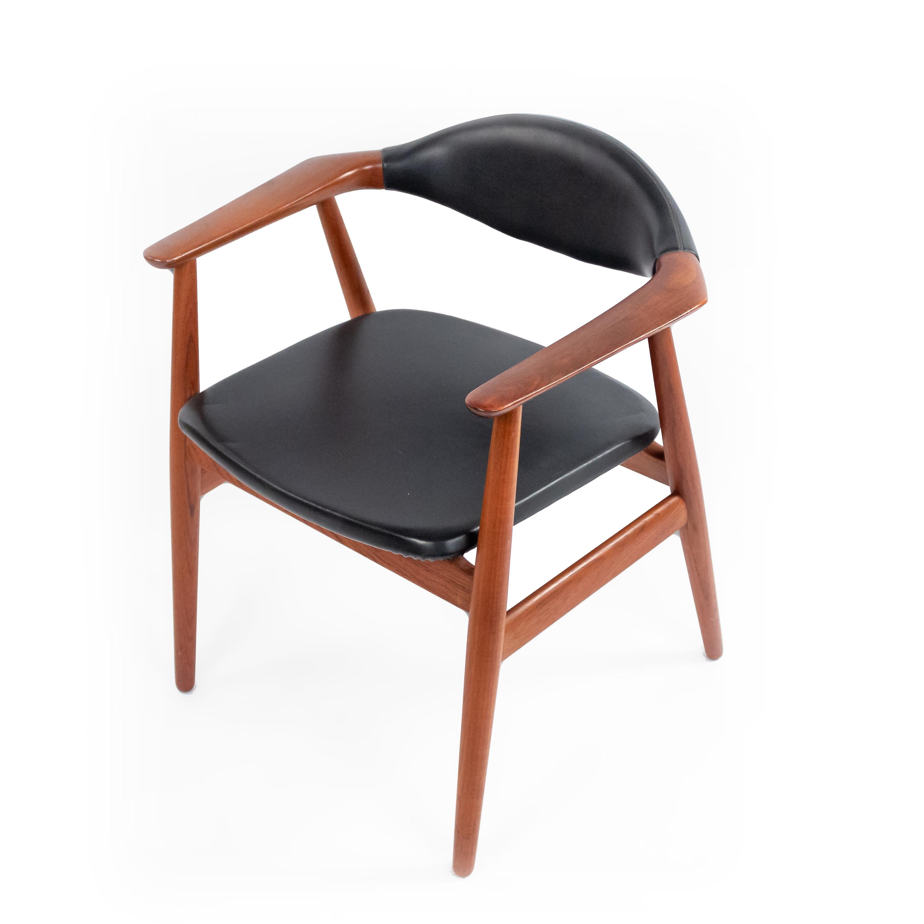 Set of 4 Midcentury Danish black vinyl and teak side chairs. Glostrup Mobelfabrik (Maker), Erik Kirkegaard (Designer).
 