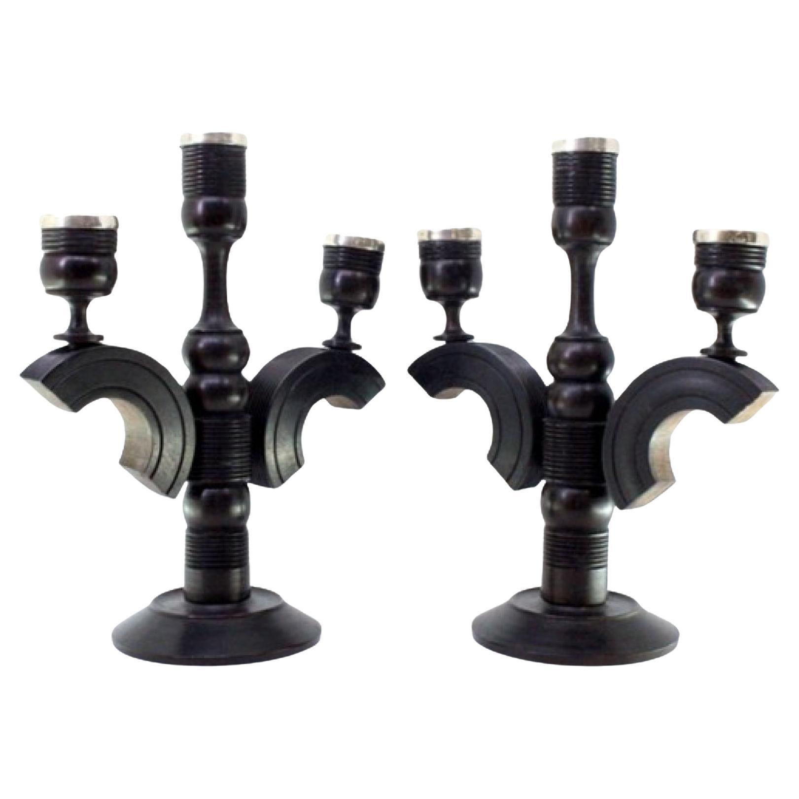 Set of black wood candelabras with silver applications on the shafts For Sale
