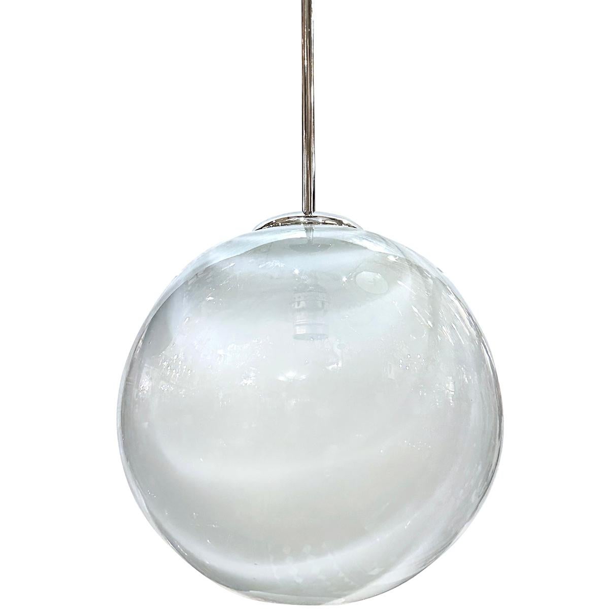 Set of six circa 1960's Italian blown glass globe light fixtures. Sold individually.

Measurements:
Drop: 24