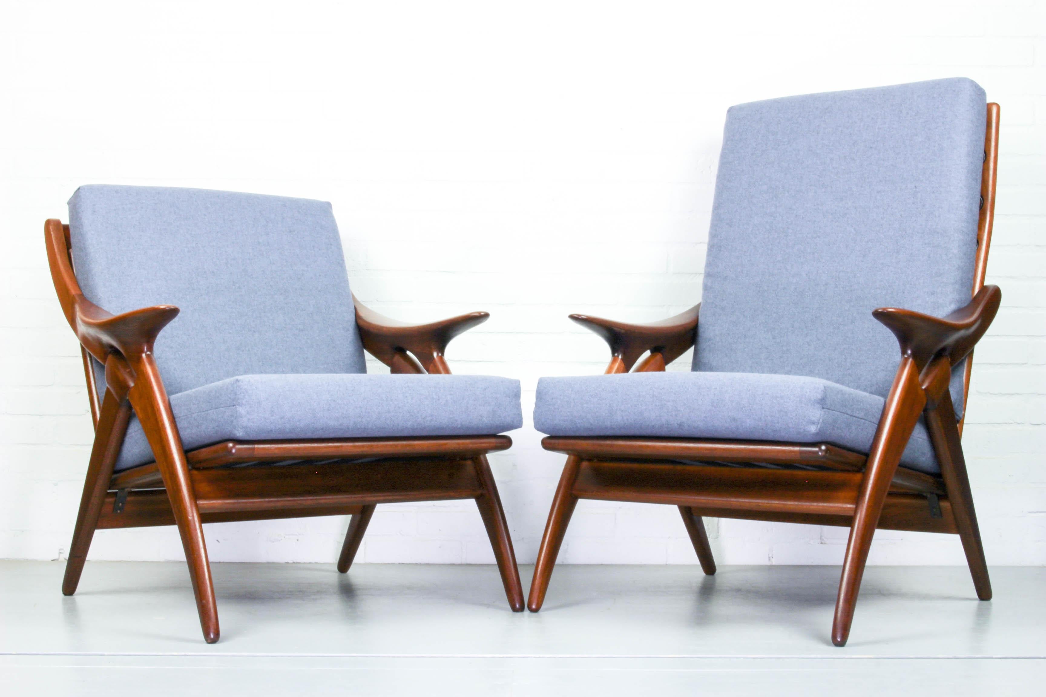 This set of teak armchair (the Knot) was made by De Ster Gelderland in the 1960s. The teak frames have organic designs with a detail shaped like a knot. The chair have new blue/grey upholstery. Dimensions: 71cm W, 80cm D, 78cm H (ladies chair) and