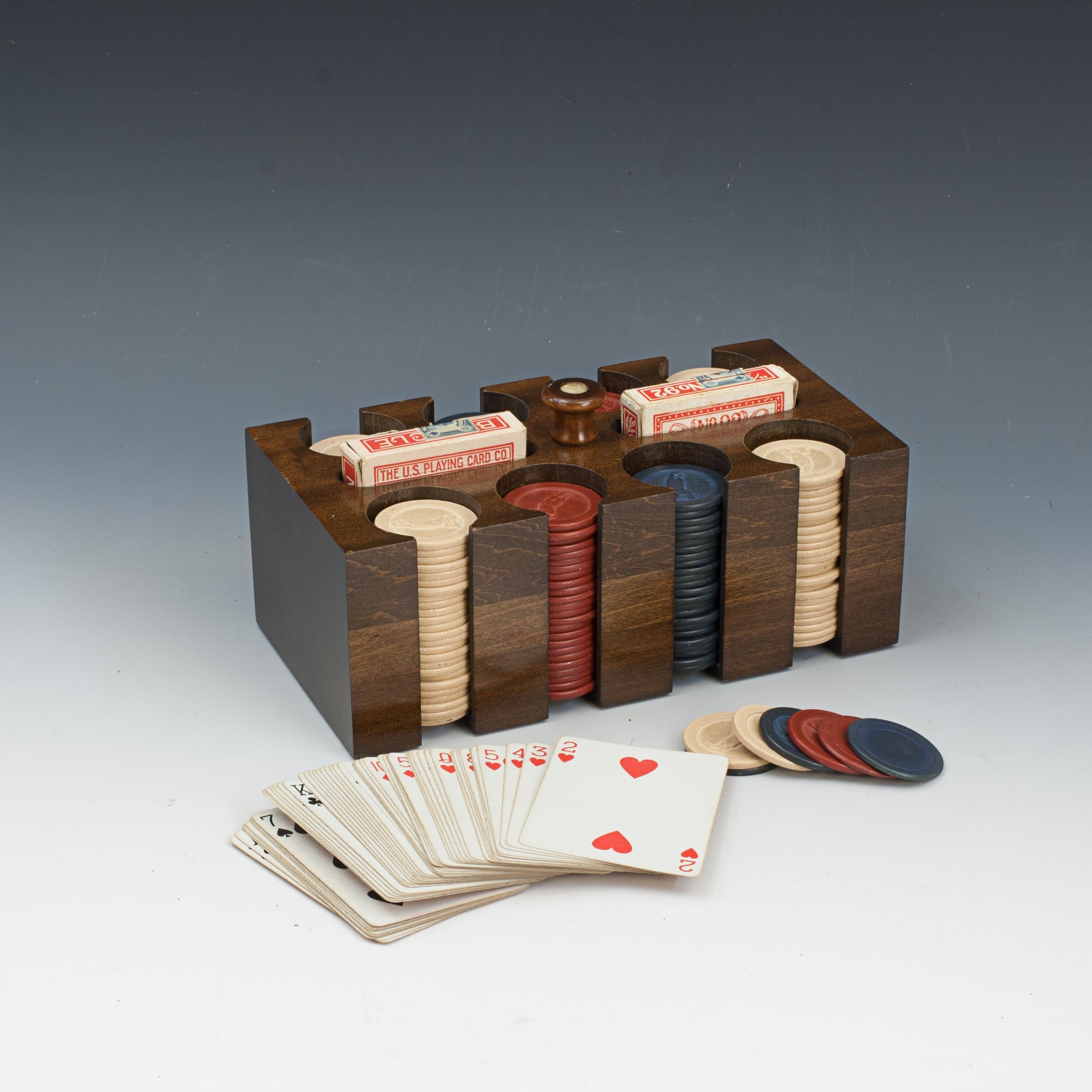 Vintage Bobby Jones Gaming Chips and Container.
A nice set of gambling counters (poker, gambling, gaming chips) in a rectangular wooden keeper. The carrier contains 8 individual circular slots containing coloured gaming chips (50 red, 51 dark blue &