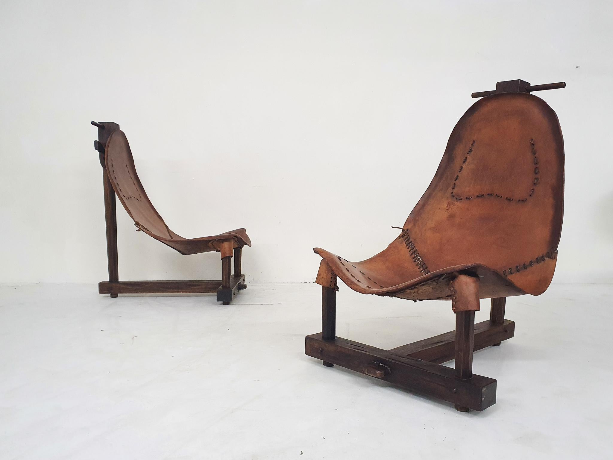 Solid wooden frames and saddle leather seating.
In good oriiginal condition. One chair has a small repair to the wood. The leather has a nice patina.