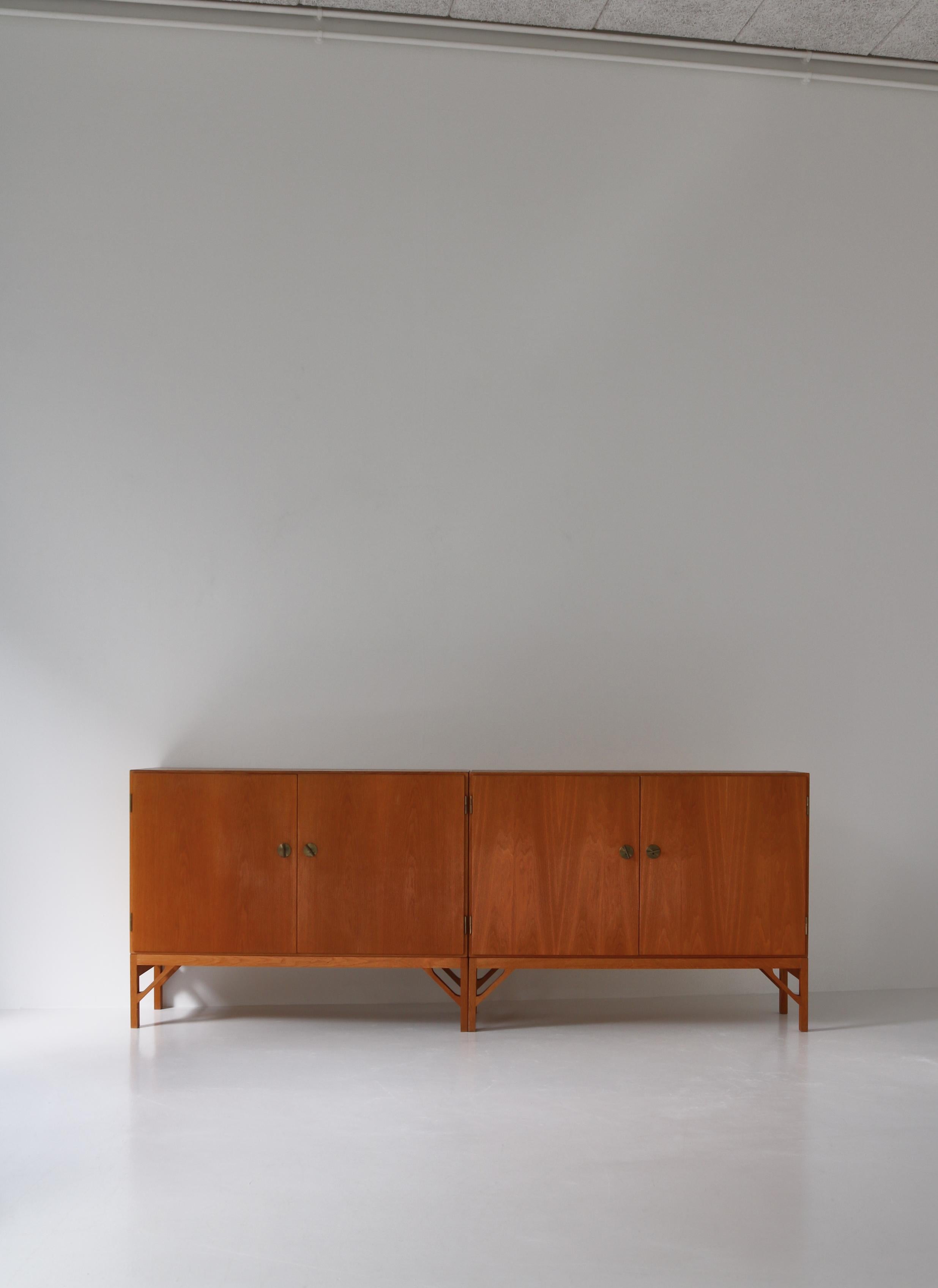 A wonderful pair of 'China' cabinets all in oak with maple interior. Beautiful keys and handles in brass. Designed by Børge Mogensen in 1960 and produced by cabinetmaker C.M. Madsens for FDB Møbler, Denmark. Both cabinets are beautifully patinated
