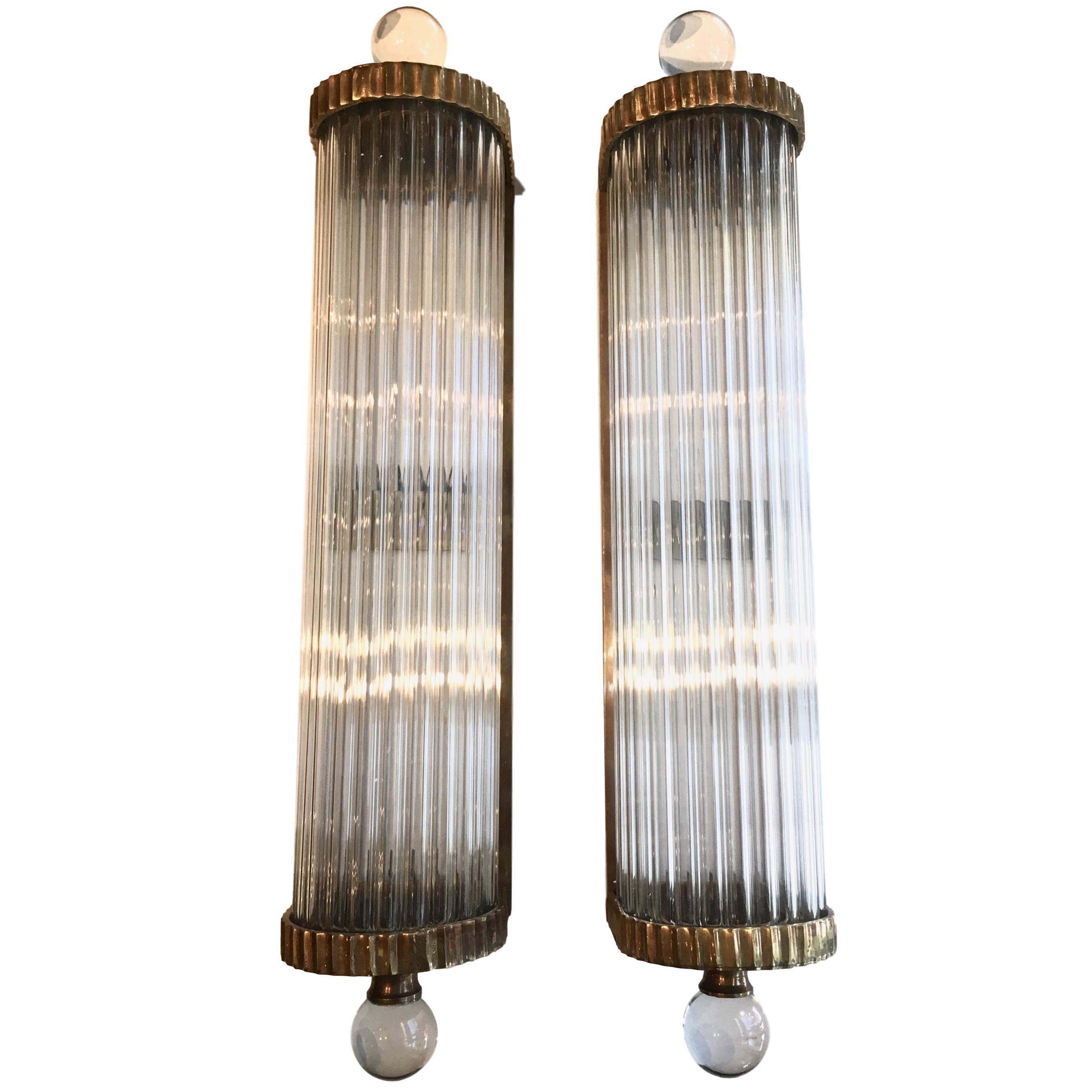 A set of eight circa 1950's Italian Art Deco patinated bronze and glass rod sconces with interior lights. Sold per pair.

Measurements:
Height: 20