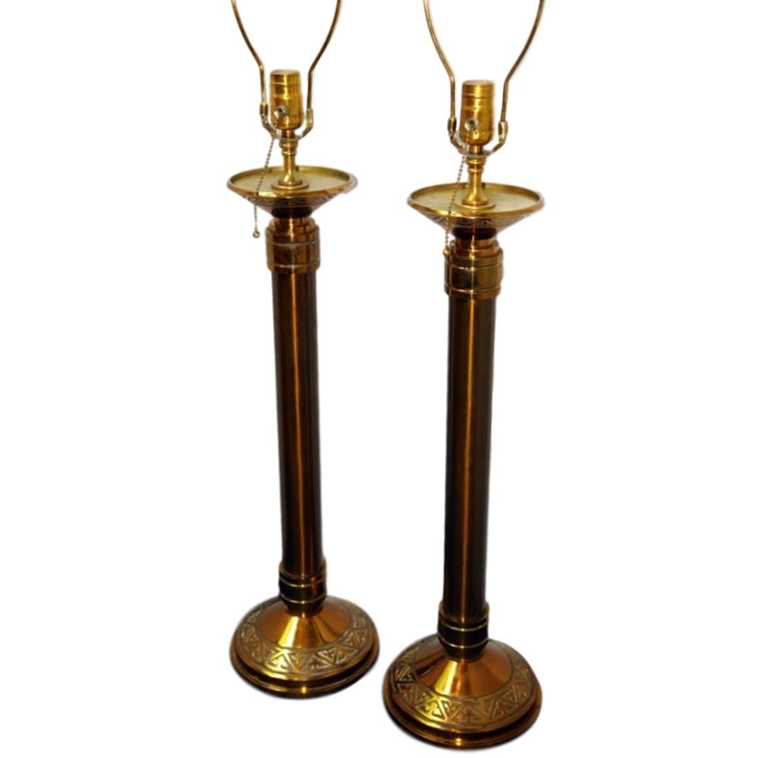 Set of four circa 1900 French candlesticks mounted as lamps with original gilt finish. Sold in pairs.


