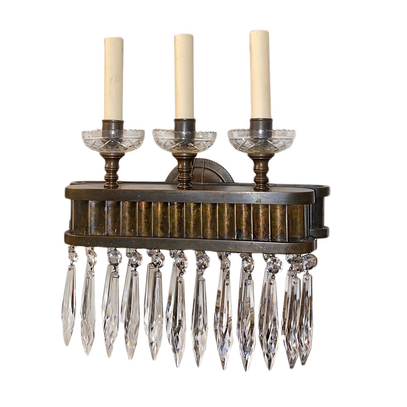 A set of four circa 1930s French bronze and crystal sconces. Sold per pair.

Measurements:
Height 15