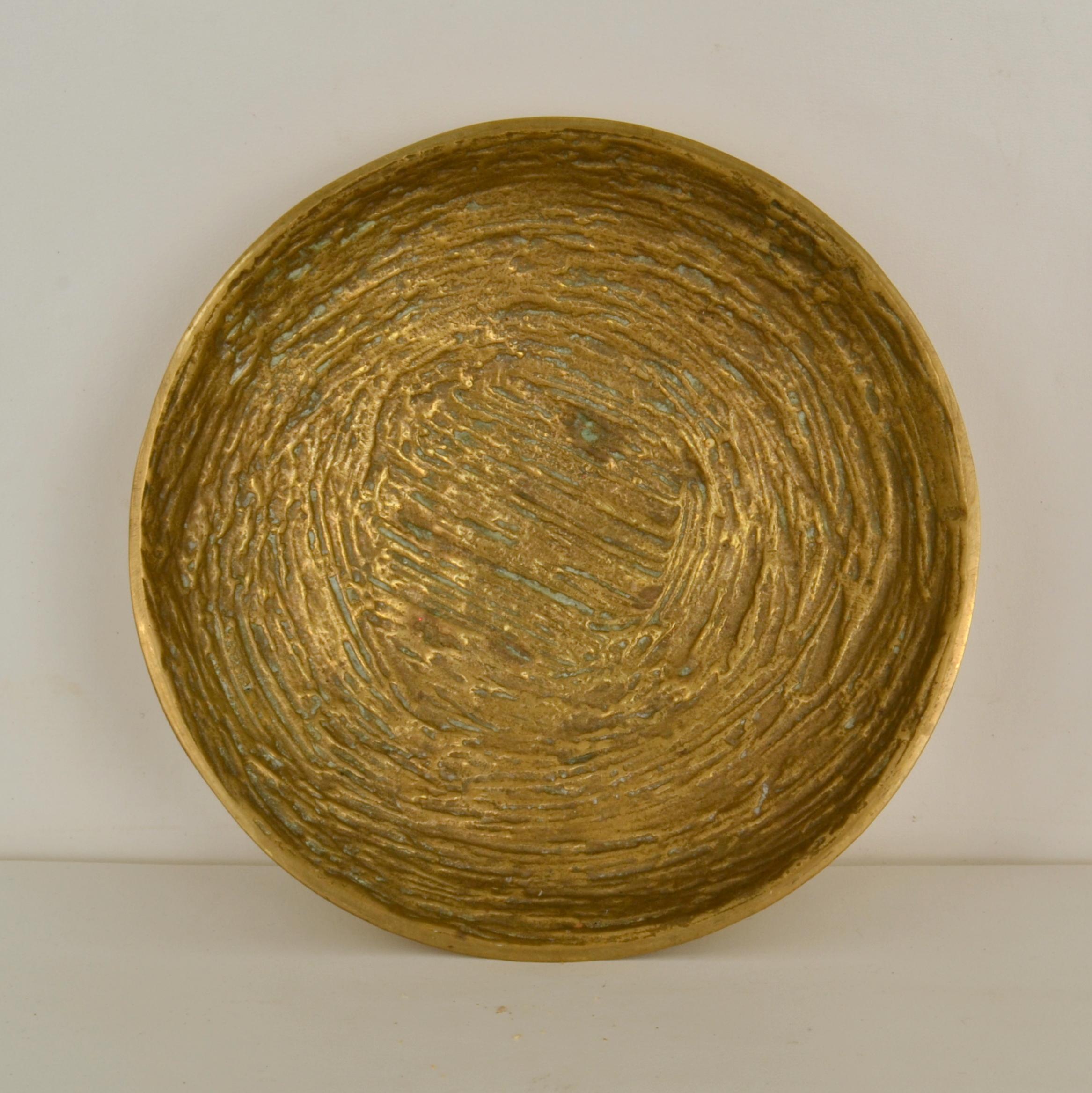 Set of four bronze decorative and functional bowls each with their own design and texture. They are heavy weight for occasional use with character made in the 1970's and are hand cast in a bronze foundry in Northern Europe.