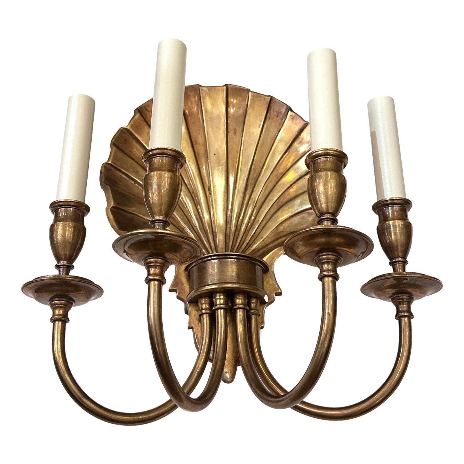 A set of 4 circa 1940's patinated bronze sconces with 4 lights each. Sold per pair.

Measurements:
Height: 14