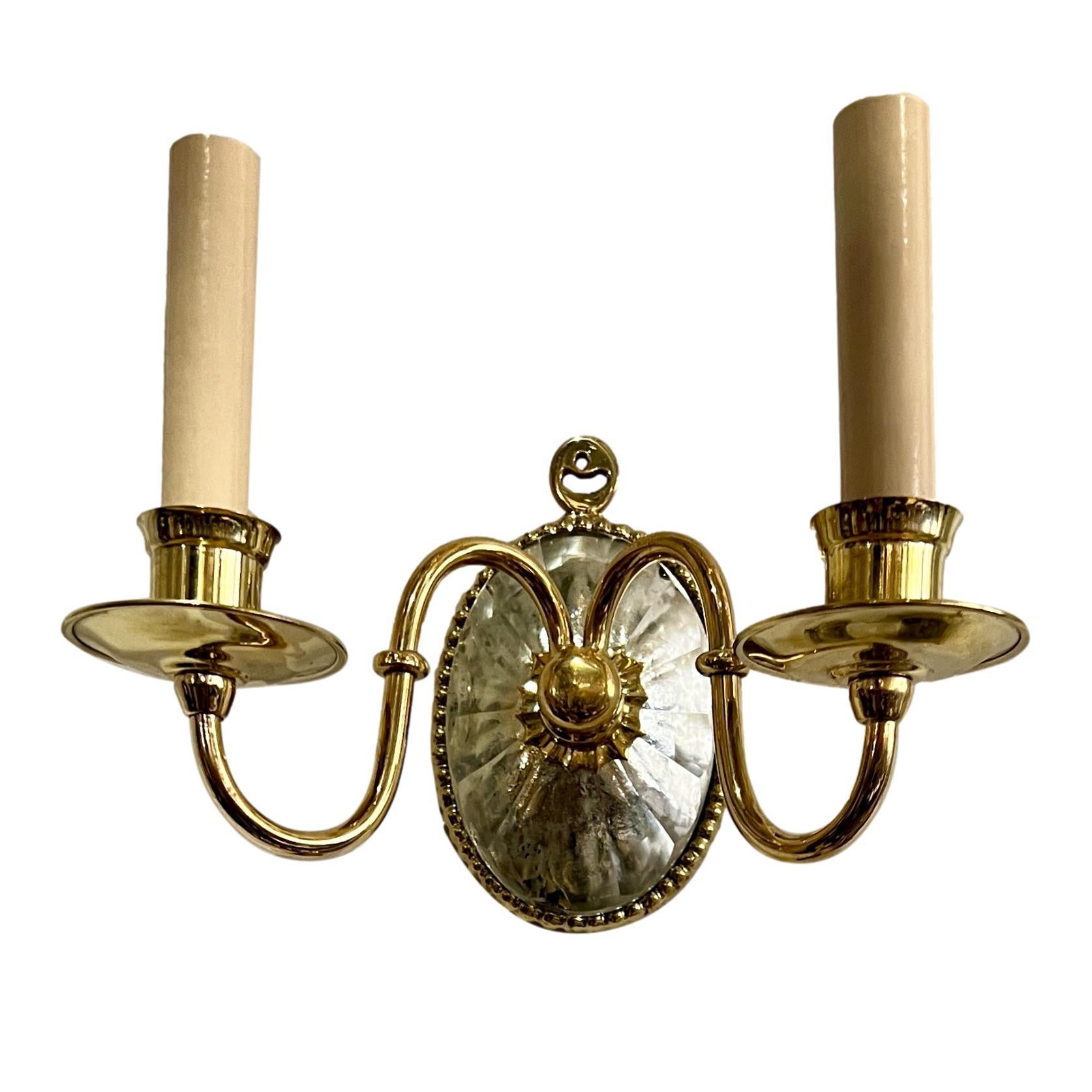 Set of four circa 1940’s English polished bronze double light sconces with original finish and molded glass backplate. Sold per pair.

Measurements:
Height: 7?
Width: 9.5
