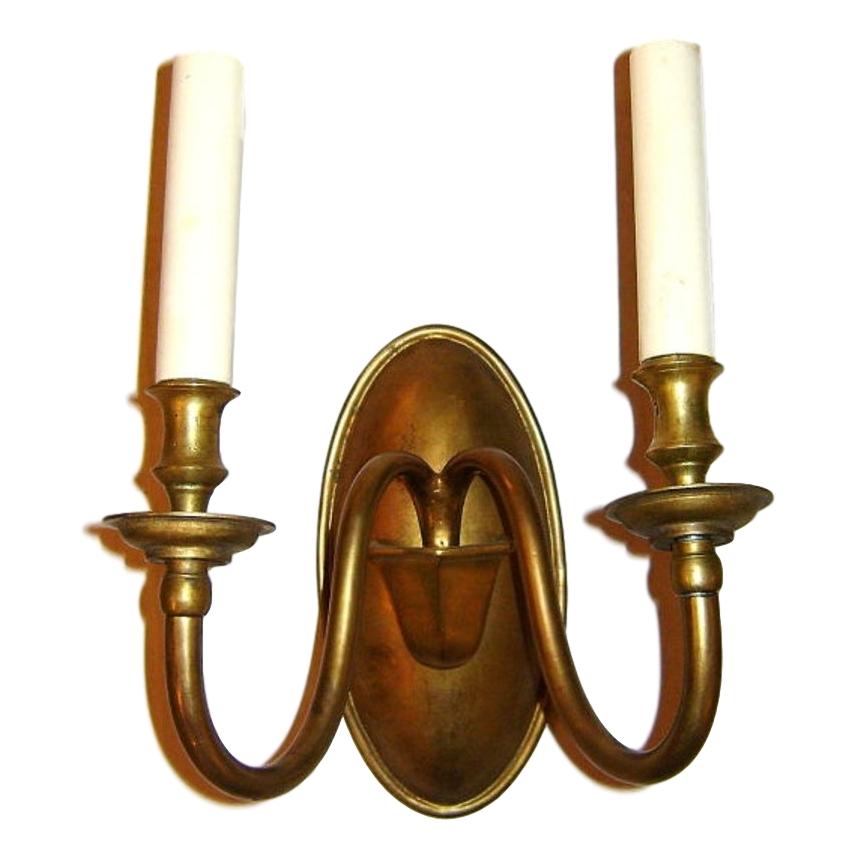 Set of four circa 1940s American patinated bronze sconces with two arms and original patina. Sold per pair.

Measurements:
Height 11.5