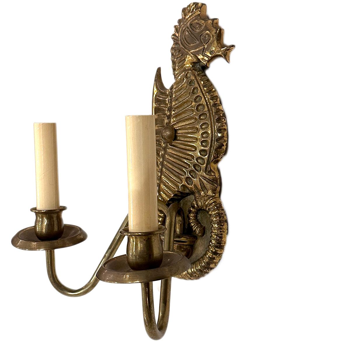 A set of  4 Italian circa 1940's bronze sea horse shaped wall sconces with double light. Sold in pairs.

Measurements:
Height: 12