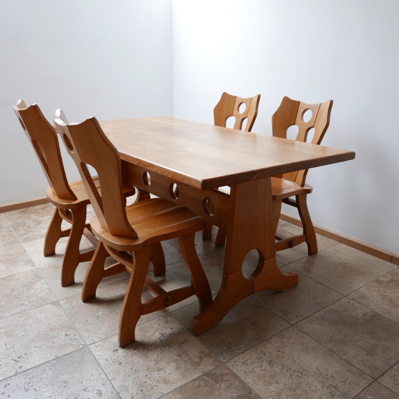 A run of four dining chairs,

Brutalist style, circa 1970s, Belgium.

Amazing form and a desirable color. 

Solid oak. 

Some occasional knocks and one small historical repair to the back of one (see photos) otherwise very good condition.