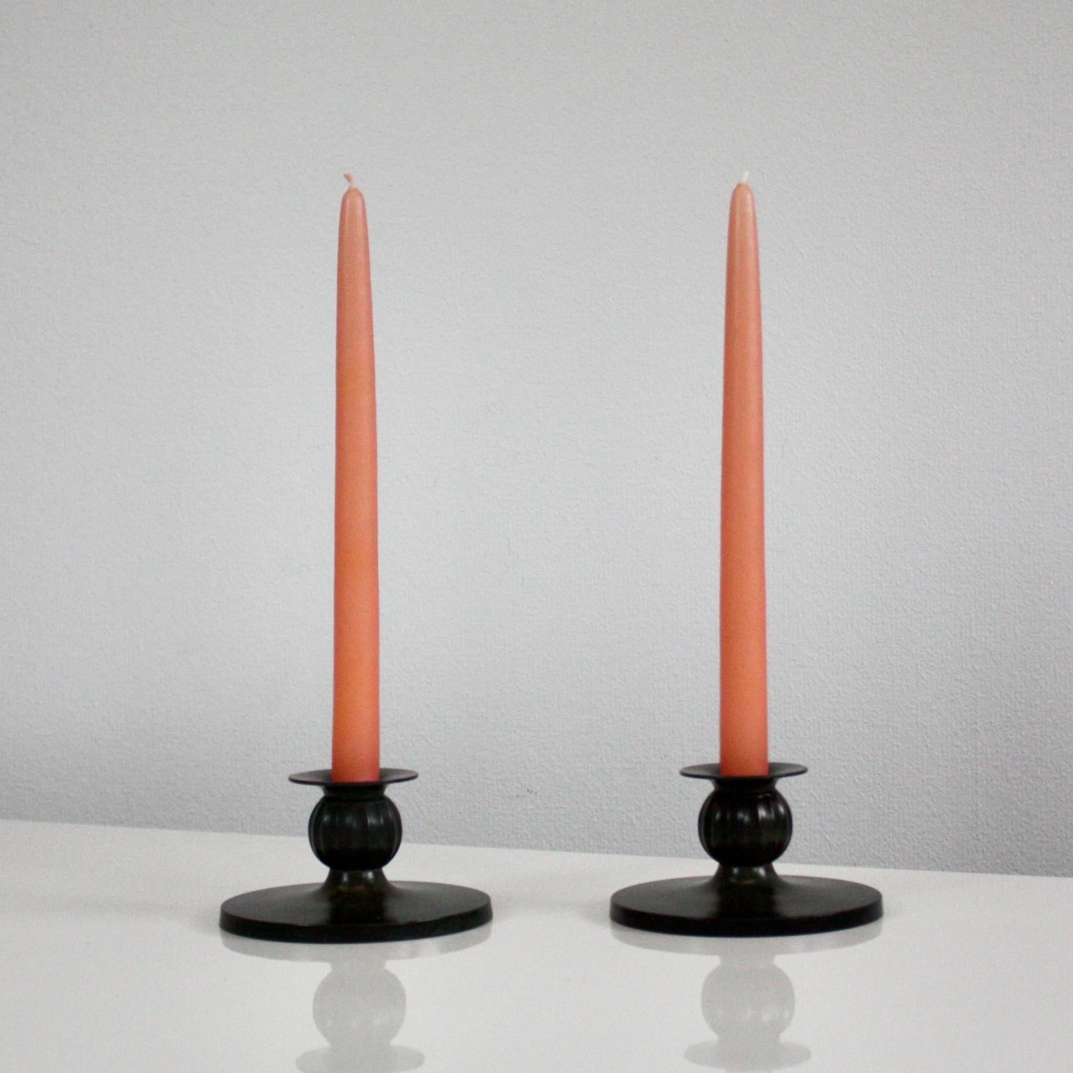 A fine set of candle holders designed by Just Andersen in 1933. 

* A pair of metal candlestick holders
* Designer: Just Andersen
* Manufacturer: Just Andersen
* Style: D1606
* Year: 1933
* Condition: Good vintage condition. Makers mark intact.  Few