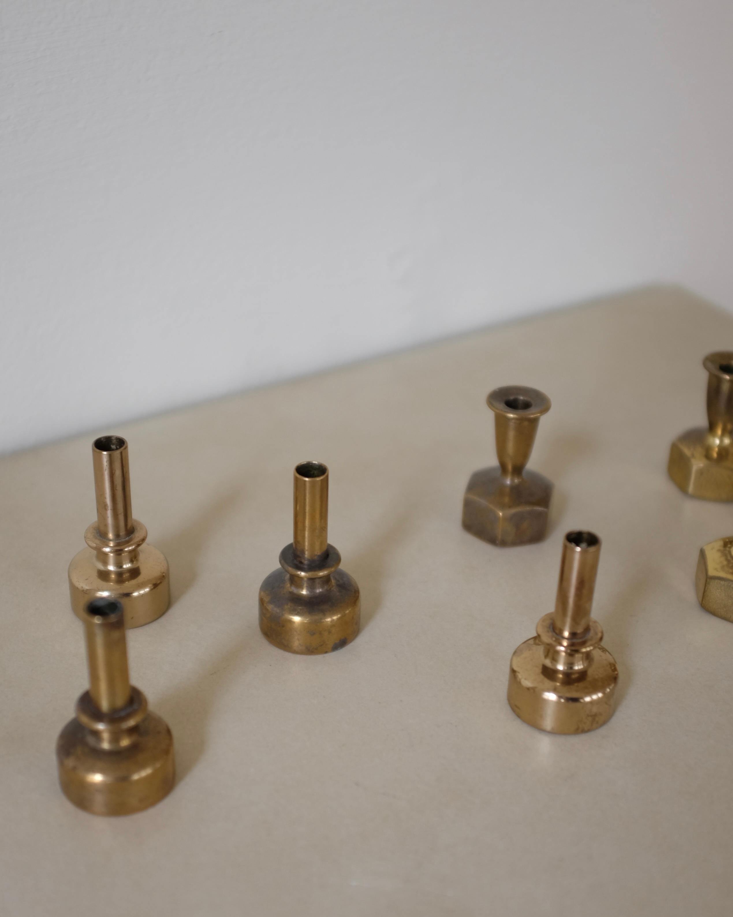 Set of 7 Small candle holders in Model L125 and L 92 by Hans-Agne Jakobsson. Made by the designers own company in Sweden circa 1950s with age appropriate wear. Candles are not included.

Dimensions: H 2.2-1.6 in. x W 1.2 in.
