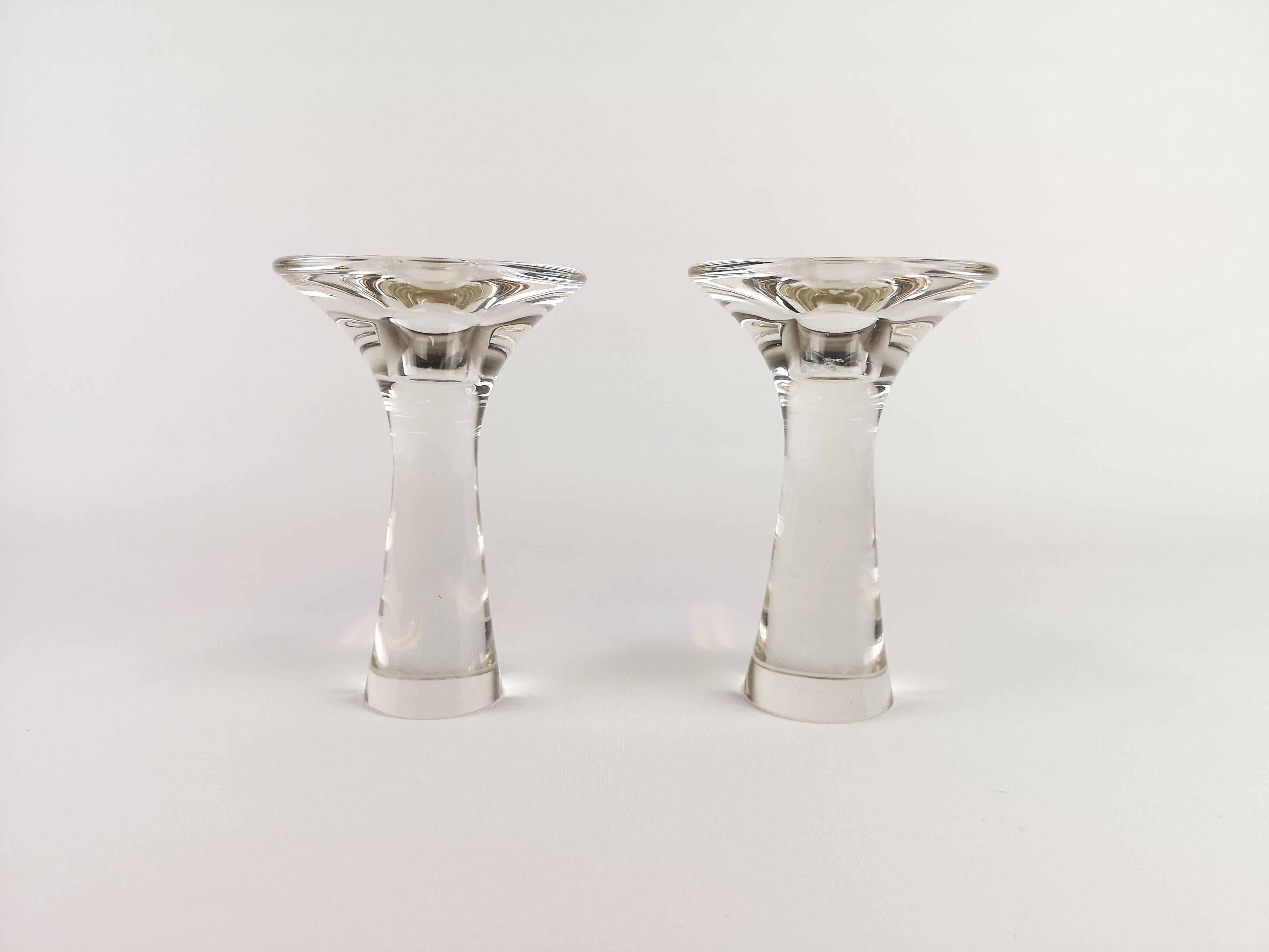 These 2 glass candlesticks are designed by Tapio Wirkkala is called Model 3412.
The object is a classic manufactured by the Finnish workshop Iittala. The pieces is from the 1960s and signed on the bottom 