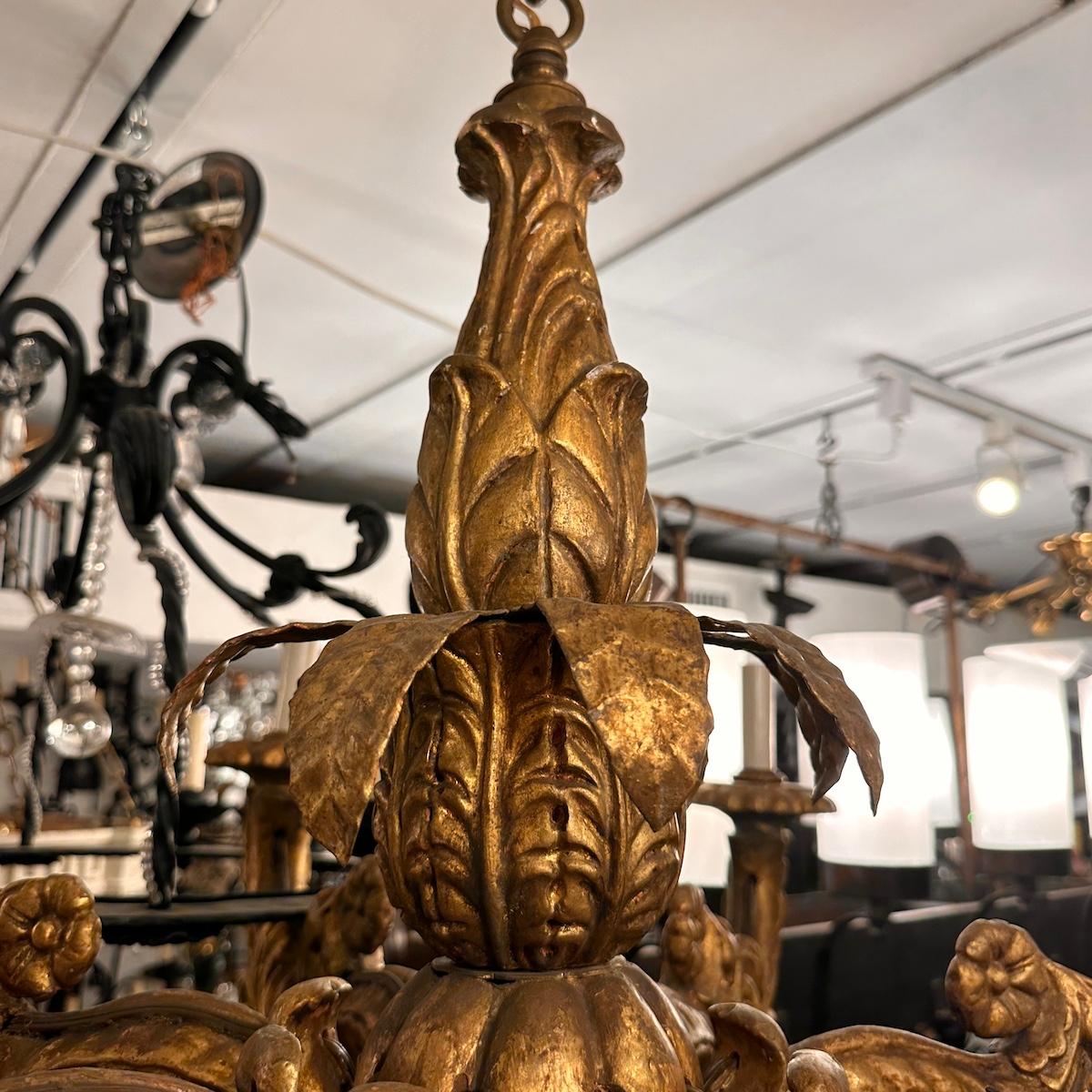 A set of 6 circa 1900 French carved and gilt wood chandeliers with original patina. Sold individually.

Measurements:
Height of body: 25