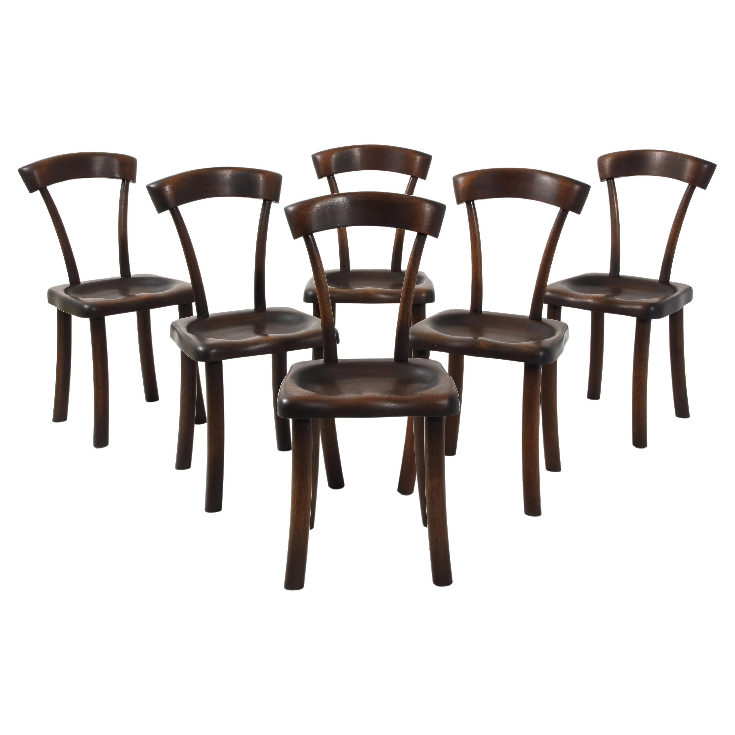 Set of Carved Mahogany Dining Chairs After Alexandre Noll, France 1960's For Sale