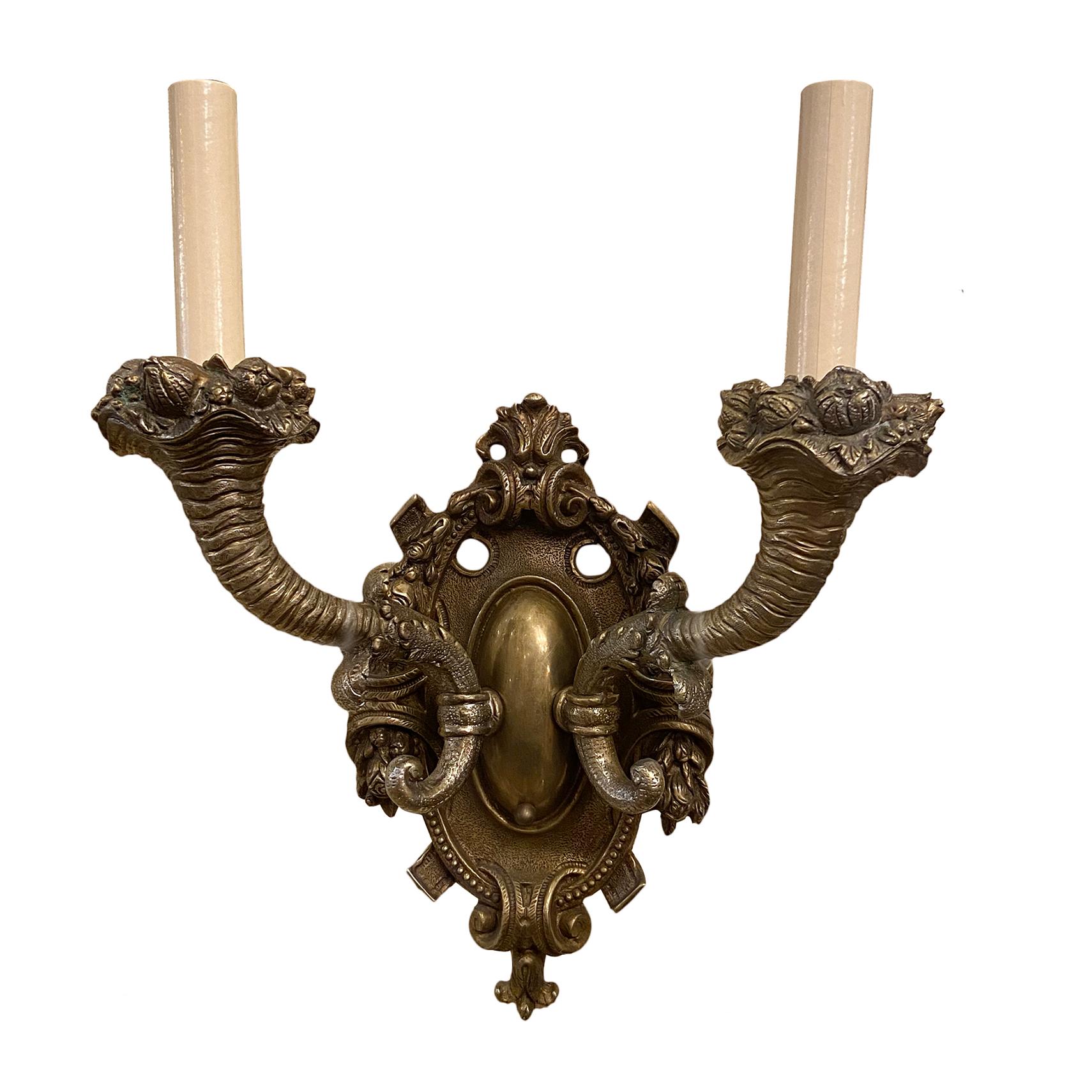 Set of four circa 1920's French cast bronze sconces with original patina.

Measurements:
Height: 15.5