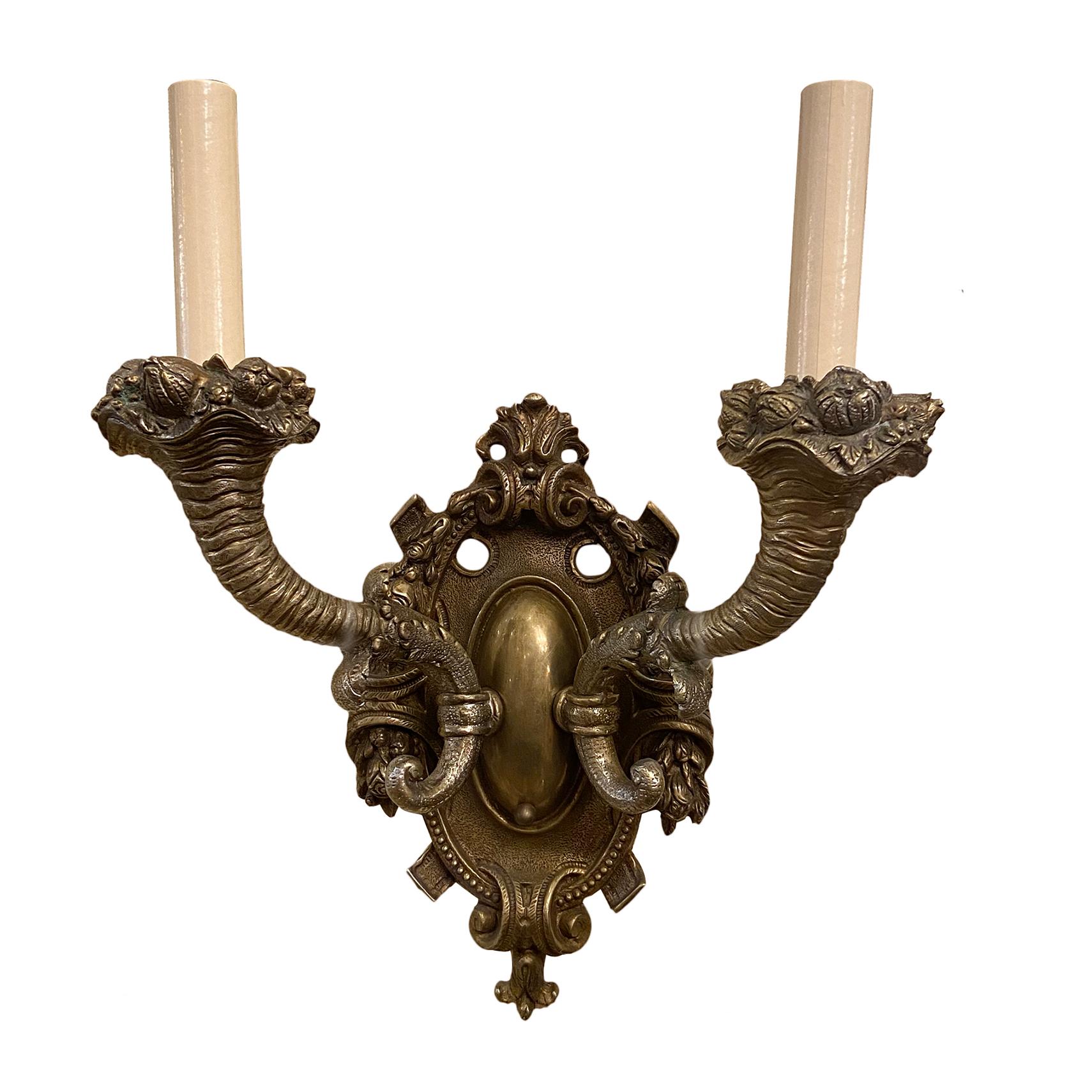 Set of four circa 1940's French Cast bronze sconces with original patina. Sold in pairs.

Measurements:
Height: 15.5