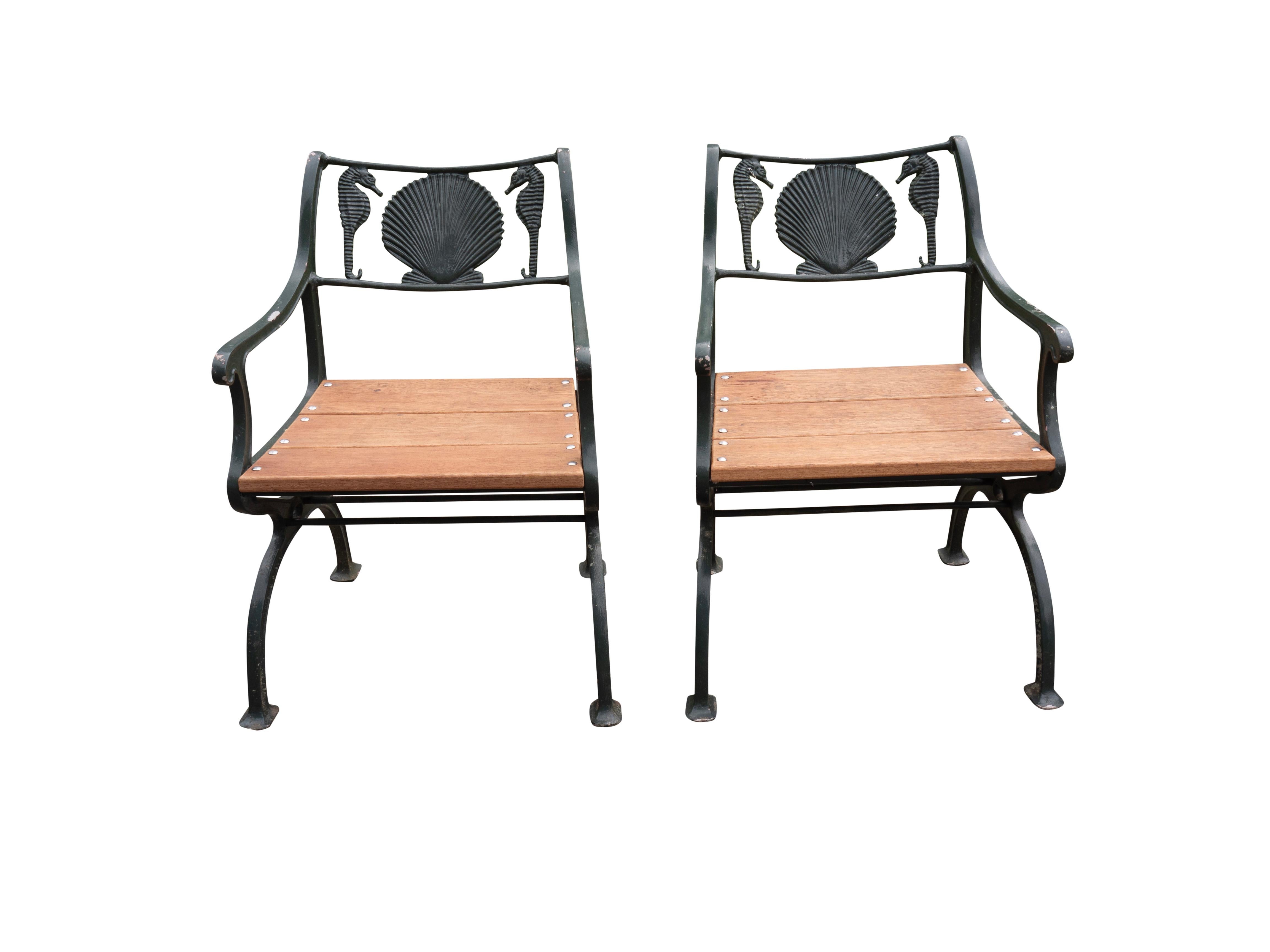 Comprising a two seat settee and pair of arm chairs in cast iron and an additional pair of cast aluminum to match. New wood seats. 