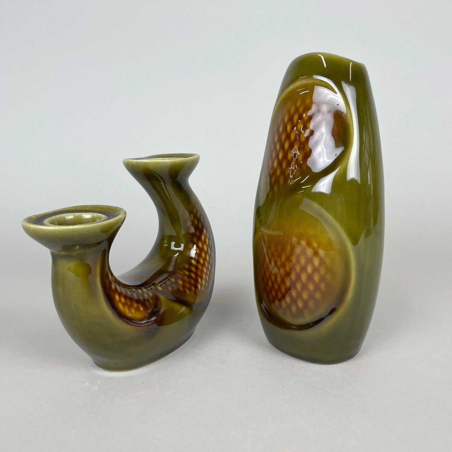 Set of mid century Ditmar Urbach vase and candlestick, made in former Czechoslovakia in the 1960's. In very good condition. 
The vase is approximately 21.5 cm (8.5 inch) high, 10 cm (4 inch) wide and 7 cm (2.76 inch) deep. The candlestick is about
