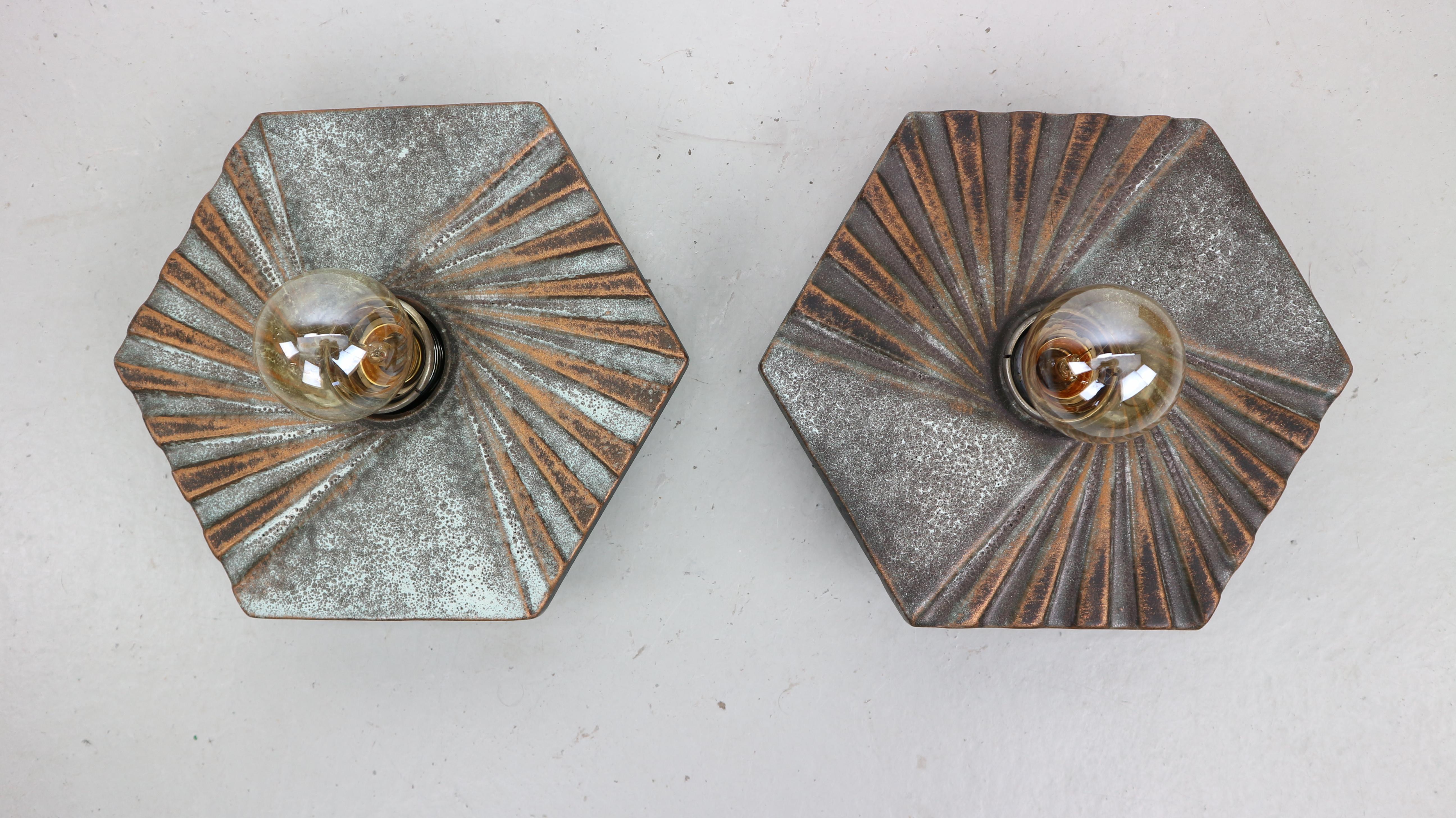 Set of 2 ceramic wall lamp scones, Fat Lava pottery by Hustadt Leuchten, West Germany, 1960s.
The lamps need Edison E27 screw bulbs.


 