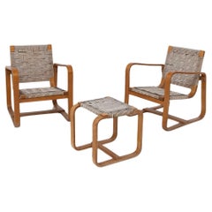 Set of chairs and ottoman by Giuseppe Pagano