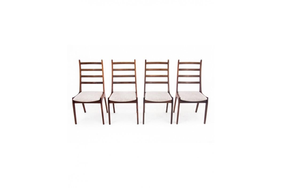 Dining set consisting of four chairs and a table from the 1960s. Furniture imported from Denmark.

The table was manufactured by Haslev Møbelsnedkeri, the underside of the top has original labels. The chairs have a very interesting, ladder-shaped