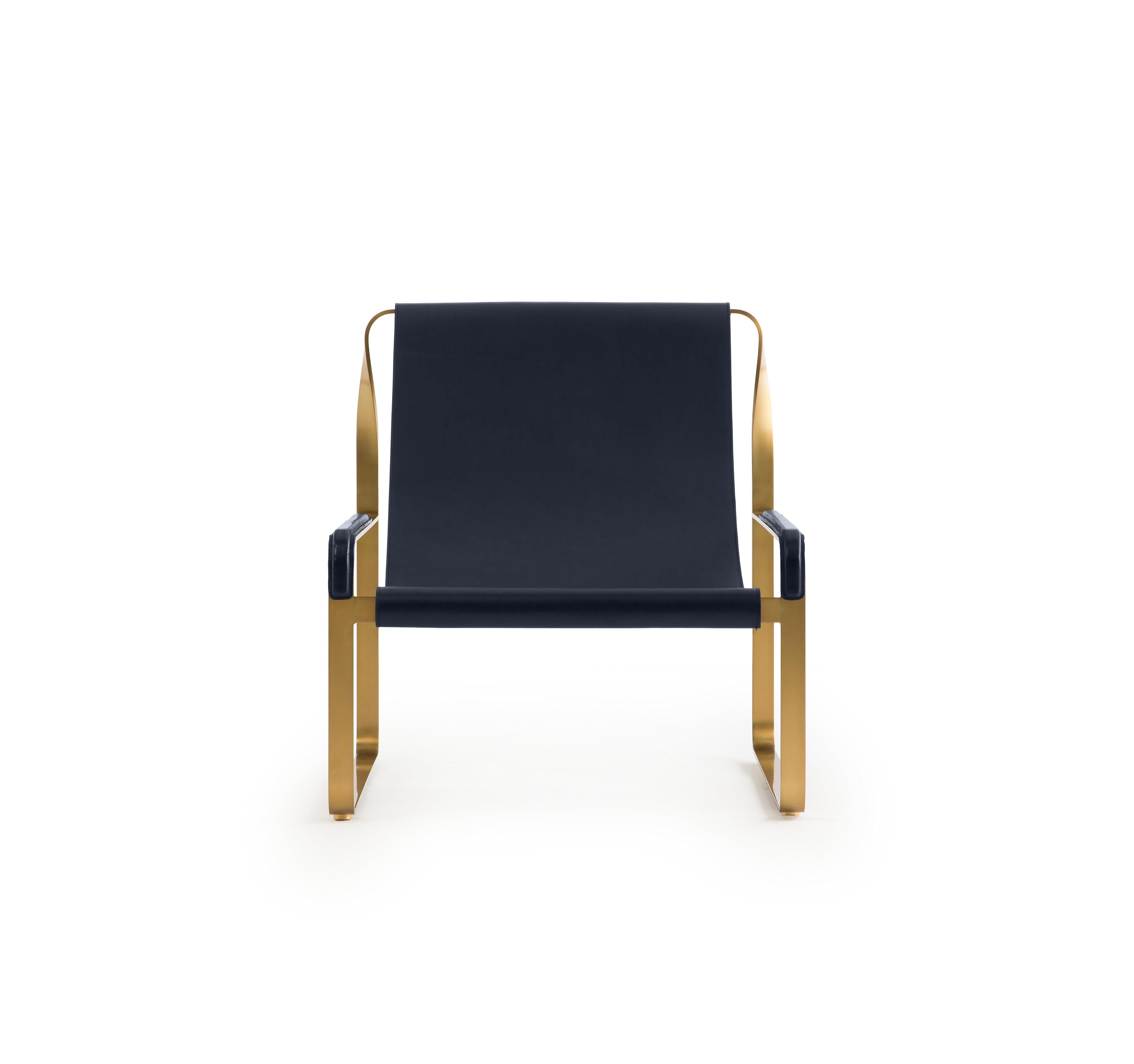 Contemporary style Wanderlust Coll. Chaise longue aged brass steel and navy blue leather.

Serene pieces where exclusivity and precision are shown in small details such as the hand-turned metal nuts and bolts that fix the leather surfaces, that go