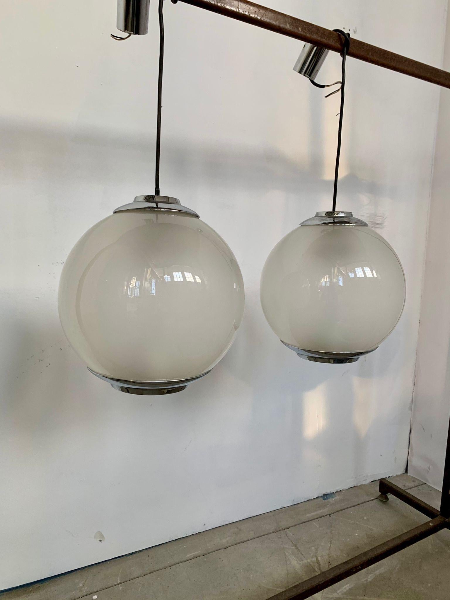 Set of chandeliers model LS2 by Luigi Caccia Dominioni manufactured by Azucena, 1960s

Opaline glass and steel chandeliers.
Designed by Luigi Caccia Dominioni and produced by Azucena. 

Good condition,  signs of time, evident in photo.