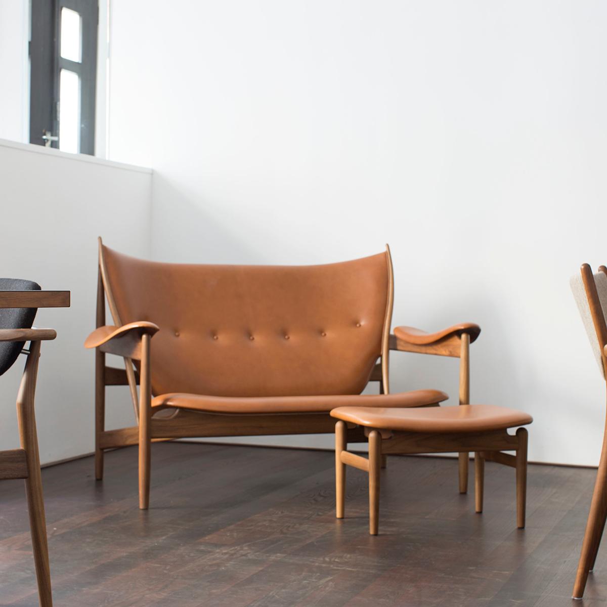 Sofa designed by Finn Juhl in 1949, relaunched in 2013.
Chieftain footstool designed by Finn Juhl in 1953, relaunched in 2015.
Manufactured by House of Finn Juhl in Denmark.

Alongside the impressive Chieftain Chair, Finn Juhl and cabinetmaker