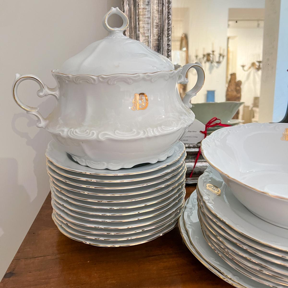 42 piece set of white china with elaborate “D” monogram on each piece. The mark is Mitterteich Bavaria W. Germany. A variety of plates, serving pieces and a large lidded Terrine.