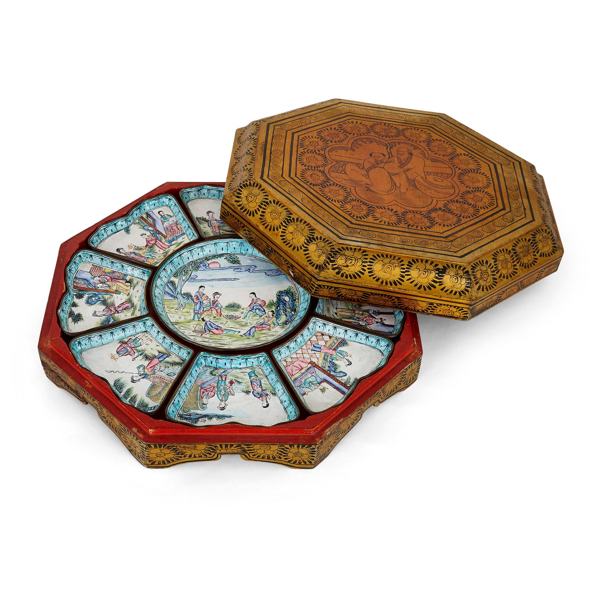 Set of Chinese enamel dishes in lacquered box
Chinese, early 20th century
Measures: Central dish: Height 2cm, diameter 37cm
Box: Height 11cm, width 40.5cm, depth 40.5cm

This beautiful set of sweetmeat dishes is crafted from Cantonese enamel.
