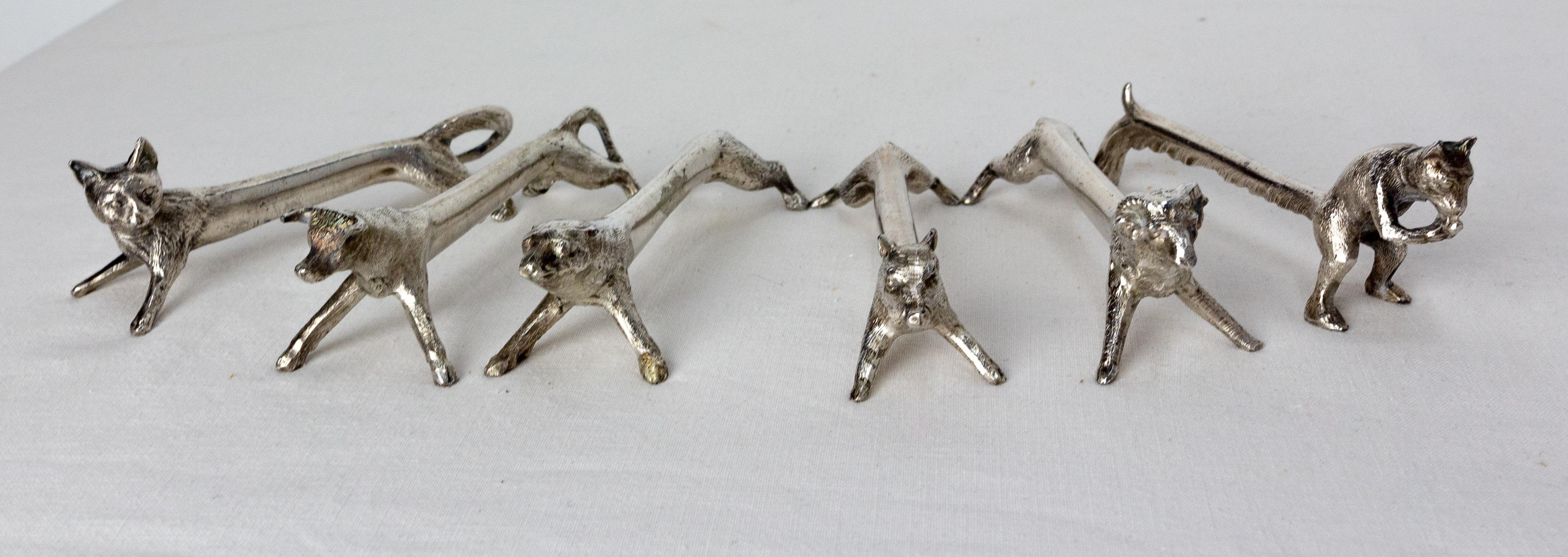 Set of six chrome knife holders shaped like animals: cat, bull, ram, squirrel, bear, wild boar.
Ideal for a refined and nature-themed table decoration
Good condition.

Shipping:
 