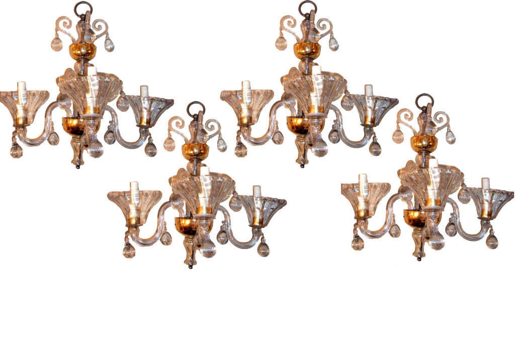Set of four circa 1920s Italian clear three-light sconces with gilt details and blown drops on arms. Sold in pairs.

Measurements:
Height: 24