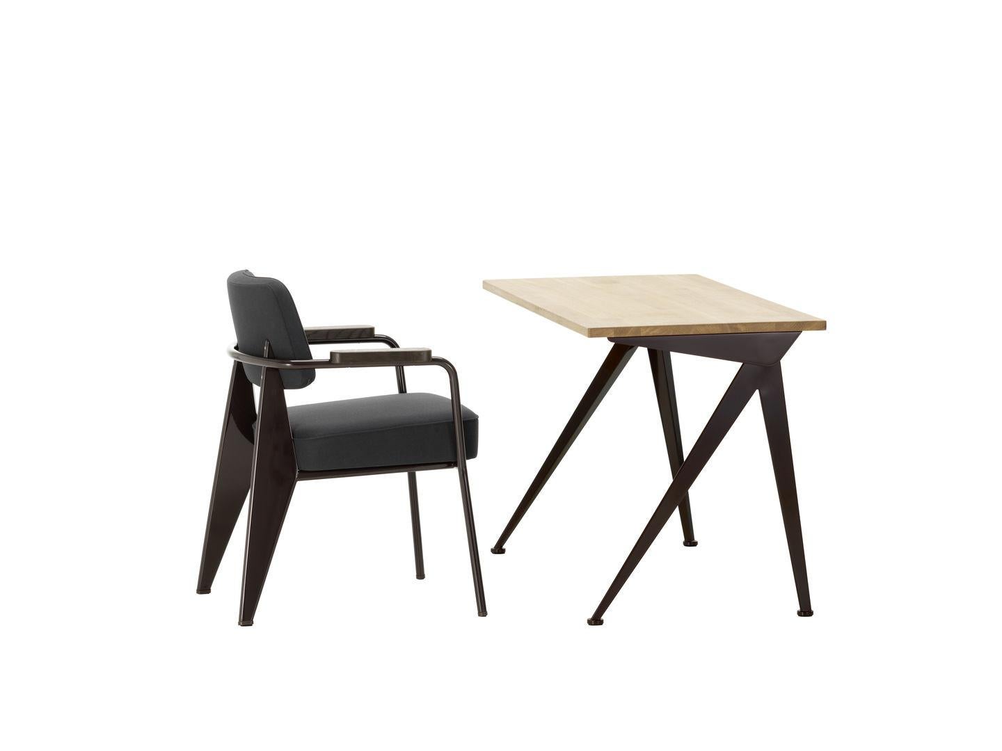 Desk designed by Jean Prouvé in 1953.
Chair designed by Jean Prouvé in 1951.
Manufactured by Vitra, Switzerland.

About Compas Direction Desk:
The slender, elegantly splayed metal legs of the Compas Direction desk by Jean Prouvé call to mind