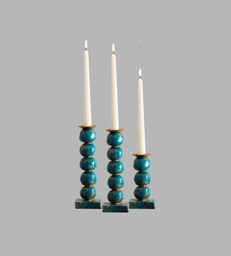 Margit Wittig has used her sculptural skills to create beautifully-crafted, well-proportioned candlesticks, which are compositions of her unique signature pearl-shaped designs.

Each candlestick begins as hand-sculpted spheres which are used to