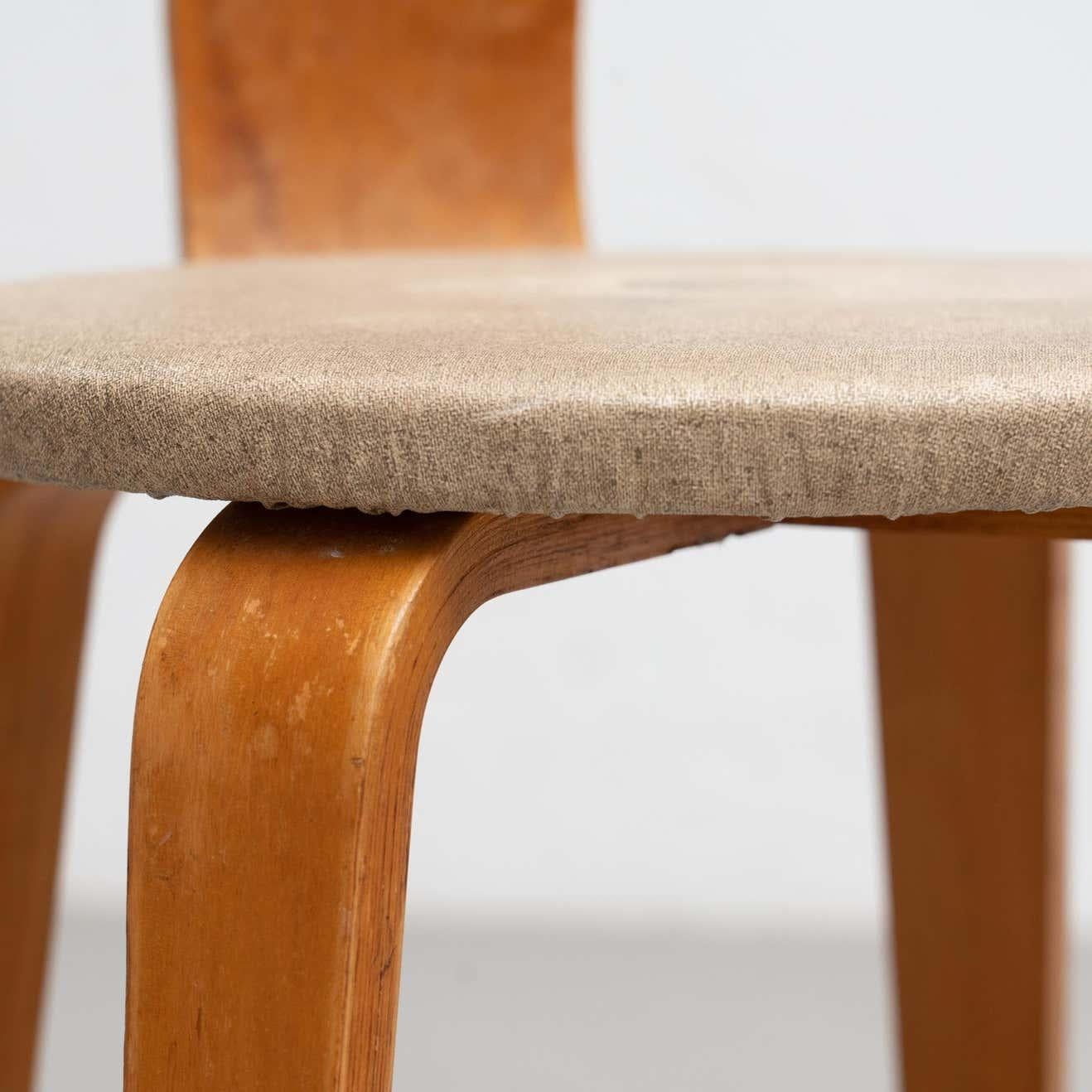 Set of chair and stool designed by Cor Alons, circa 1950.

Manufactured by Den Boer Gouda, (Netherlands), circa 1950.

Laminated Birchwood plywood and original upholstery.

Materials:
Wood
Upholstery

Measurements:
Chair: 70 H 44 W 33