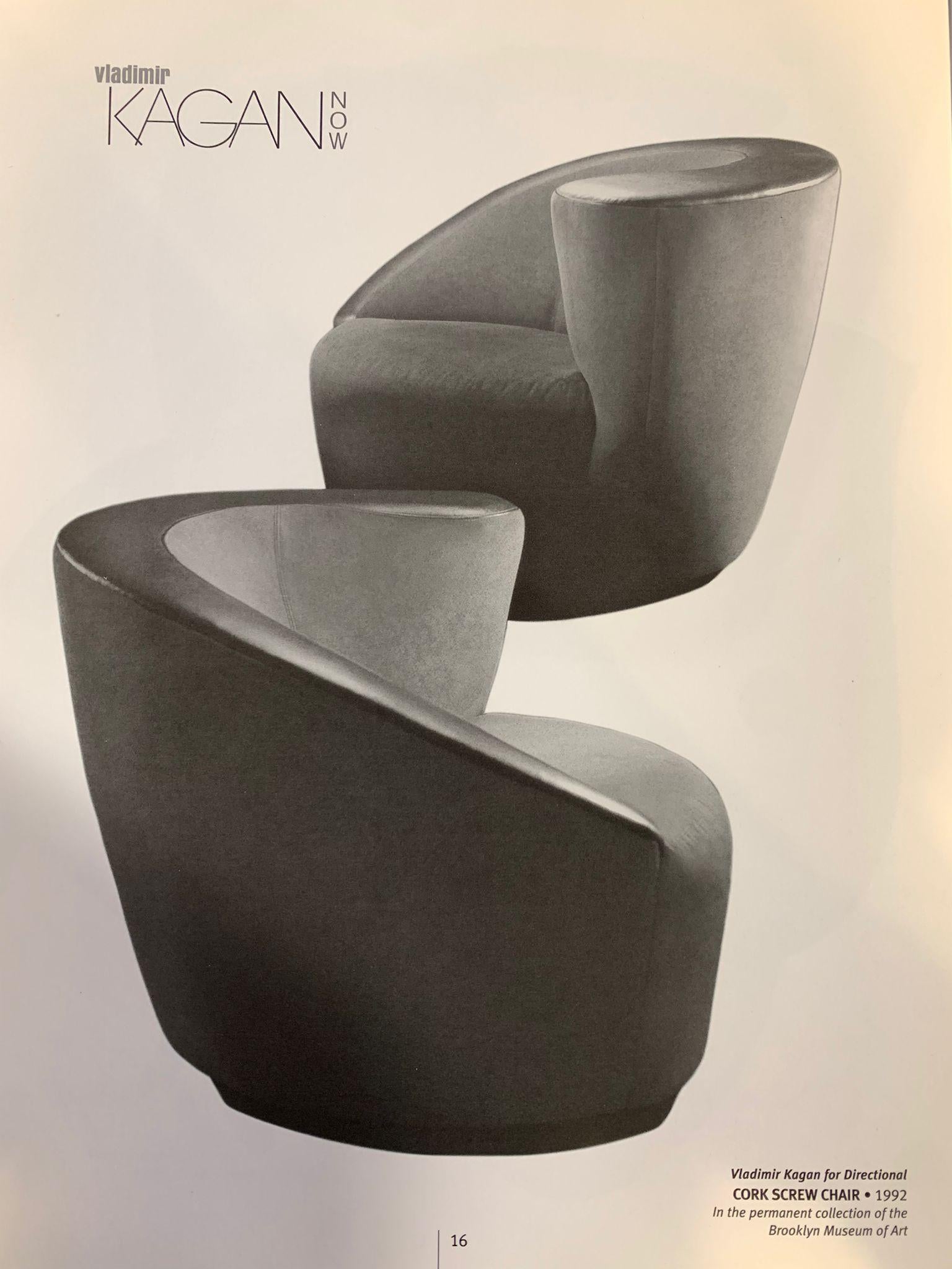 This beautiful pair of Nautilus swivel chairs by celebrated Mid-Century Modern designer Vladimir Kagan, manufactured by Directional Furniture. The chairs' form suggests an abstracted interpretation of nautilus shells with their concave curves. Fully