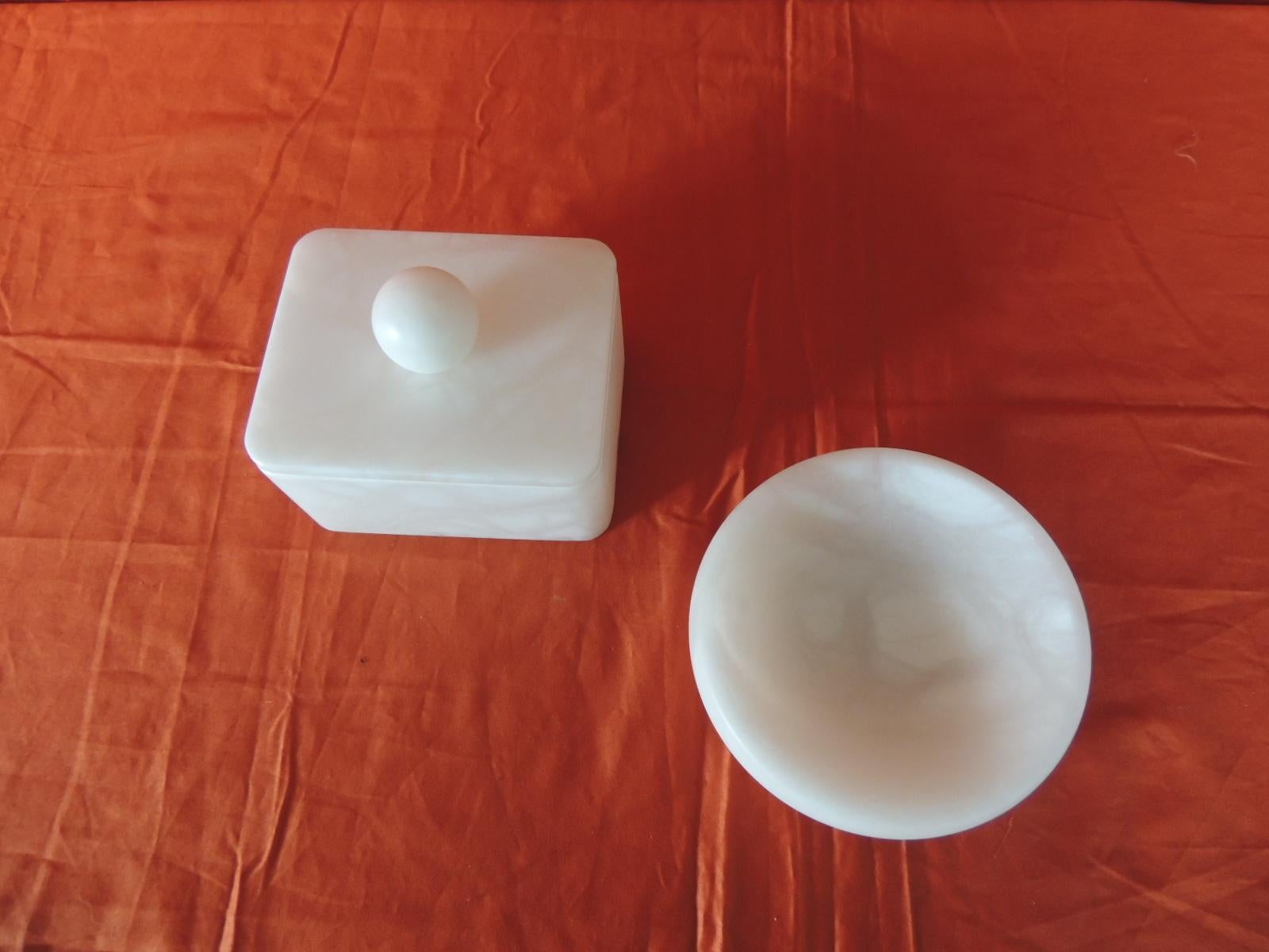 Hand carved set of covered box and round dish Italian alabaster decorative accessories.
These pieces could be use in the bathroom or on a vanity table.

