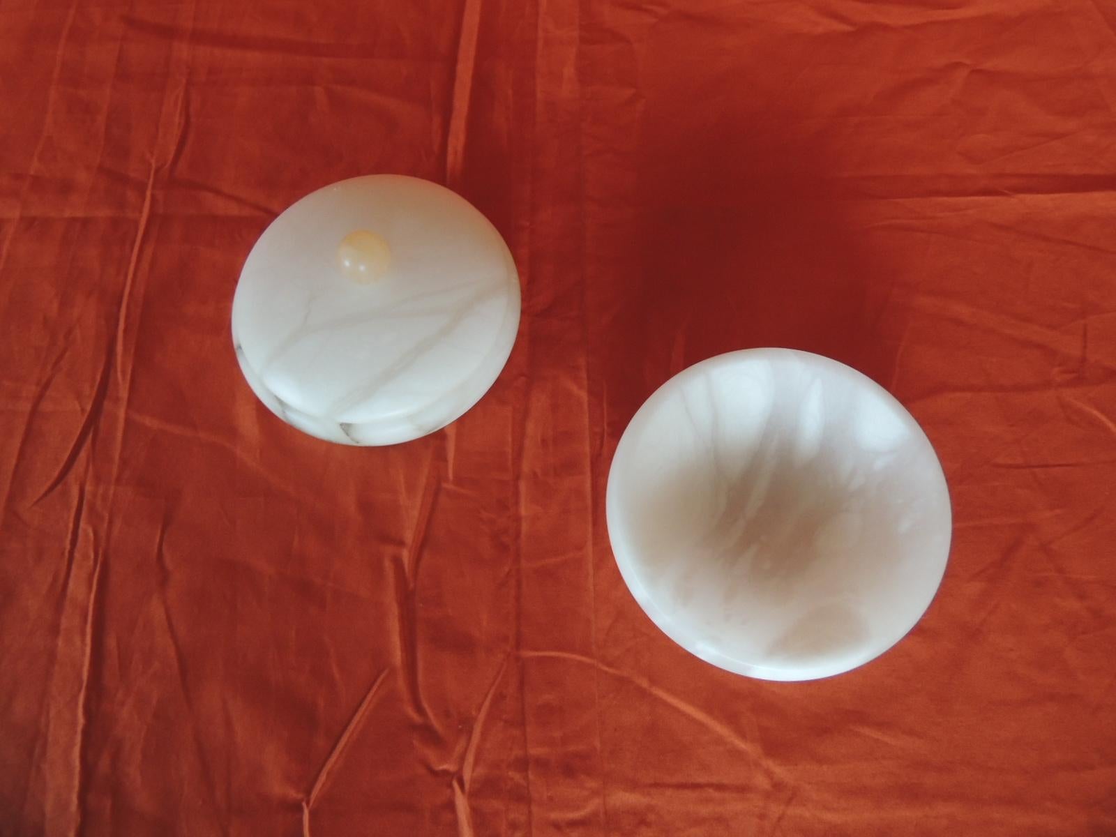 Hand carved set of covered round box and round dish Italian alabaster decorative accessories.
These pieces could be use in the bathroom or on a vanity table.
