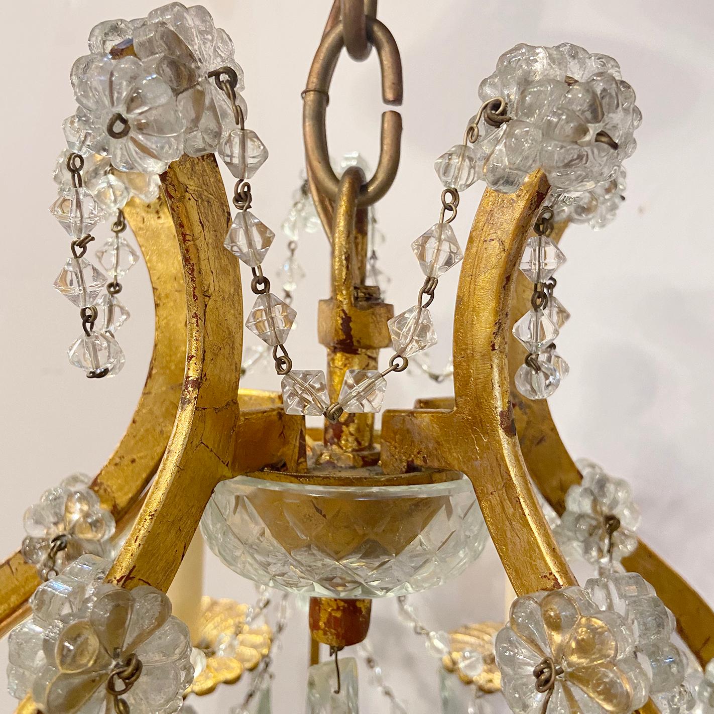 Set of three Italian circa 1930's gilt metal chandeliers with glass drops and beads. Sold individually.

Measurements:
Height: 24