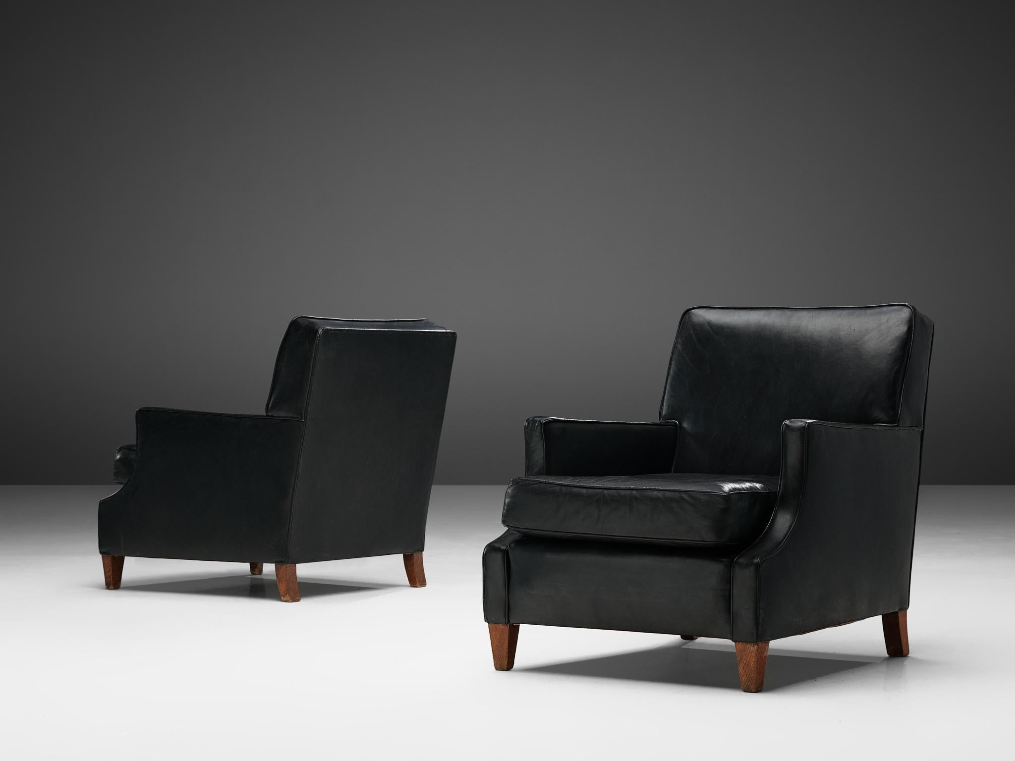 Pair of easy chairs, leather, stained beech, Denmark, 1970s

These lounge chairs embody the essence of Danish design. They are comfortable, expertly crafted, and boast a simple aesthetic that is elevated by the use of high-quality materials and