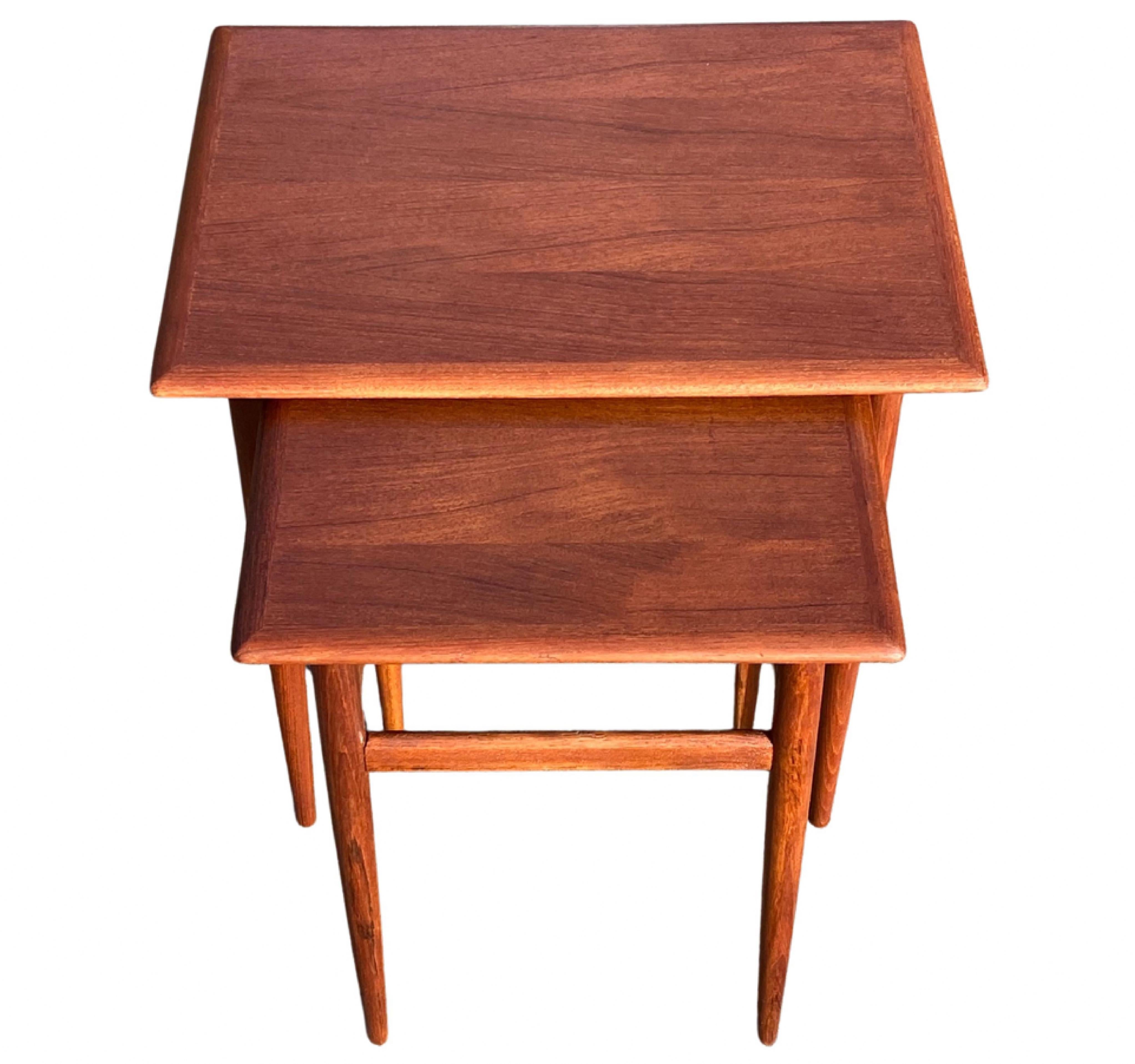 Elegant set of nesting tables by Danish furniture manufacturer. Designed and produced in 1960s. Solid teak. Measures are the largest of the tables.

The tables are inspired and resembles nesting tables designed by Hans J. Wegner and Johannes