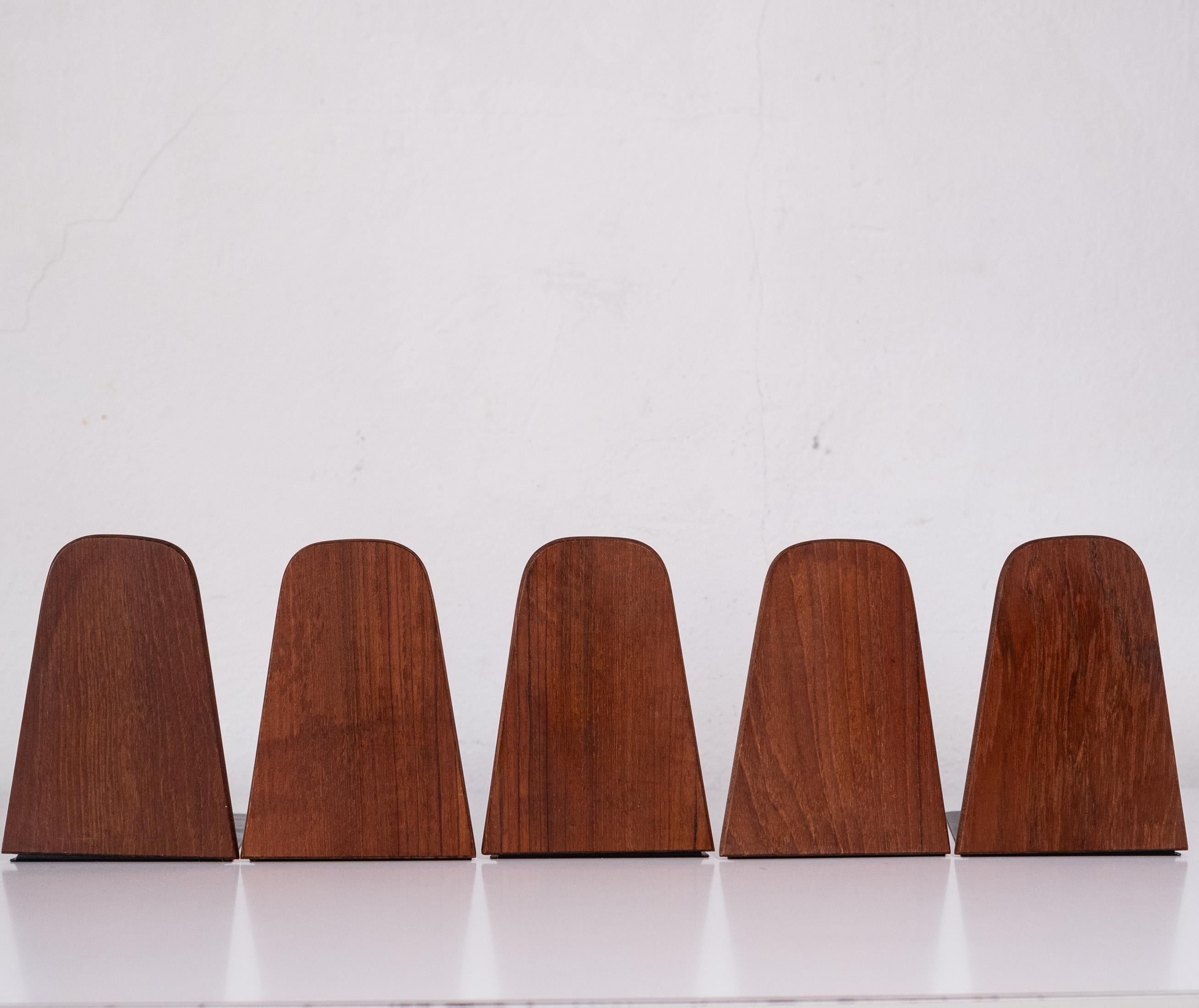 Set of five teak and metal bookends from Denmark. Designed by Kai Kristiansen and manufactured by FM Møbler. 1960s.