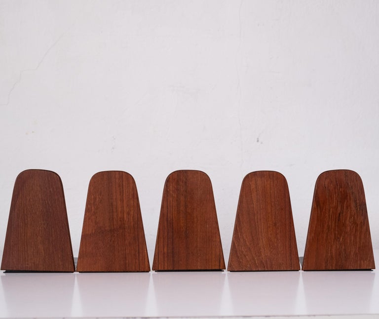 Set of five teak and metal bookends from Denmark. Designed by Kai Kristiansen and manufactured by FM Møbler. 1960s.