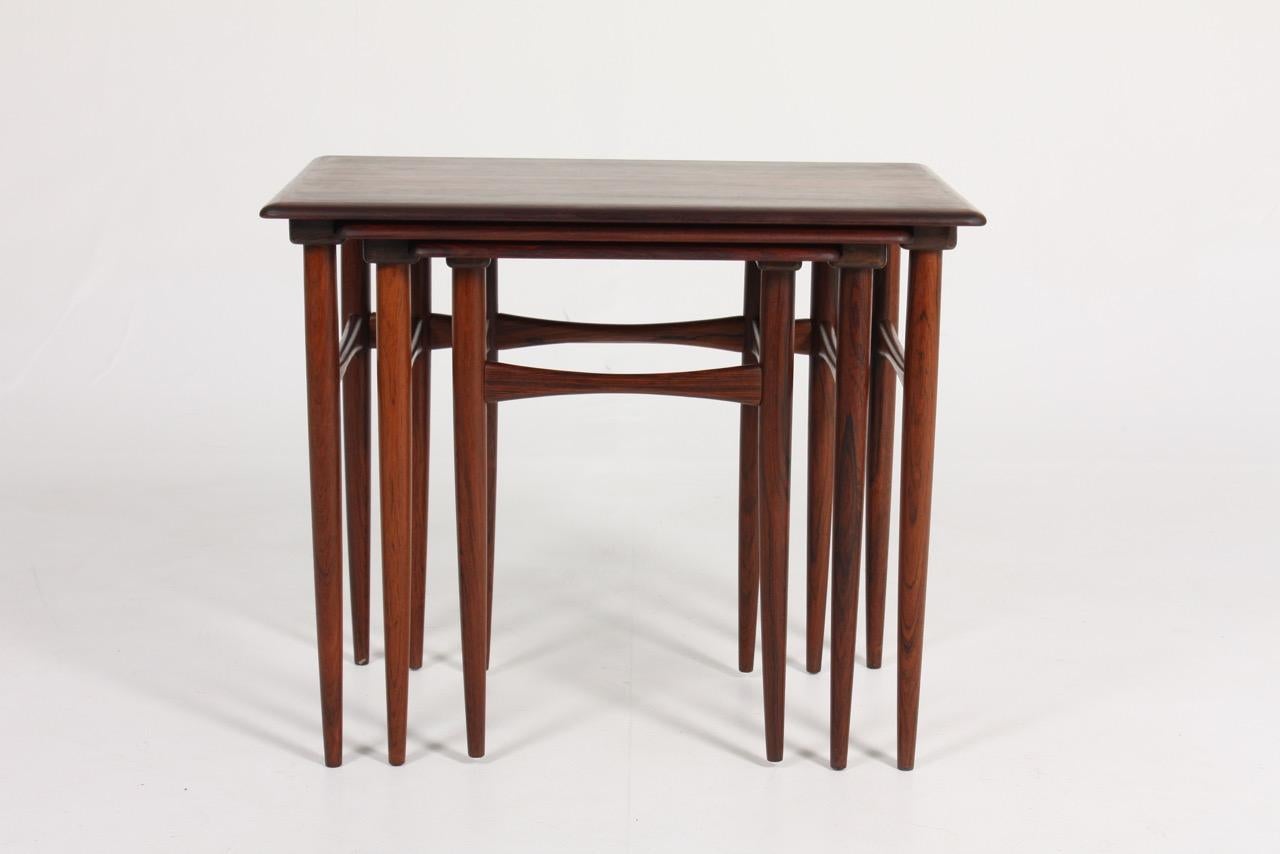Set of nesting tables in rosewood designed and made by Poul Hundevad in 1960s. Great original condition.