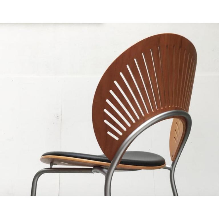 High-quality barstools with leather upholstery from the Trinidad series by the Danish manufacturer Fredericia, designed by Nanna Ditzel.

The characteristic element of the Trinidad series is the fan-shaped design of the backrest. In addition to the