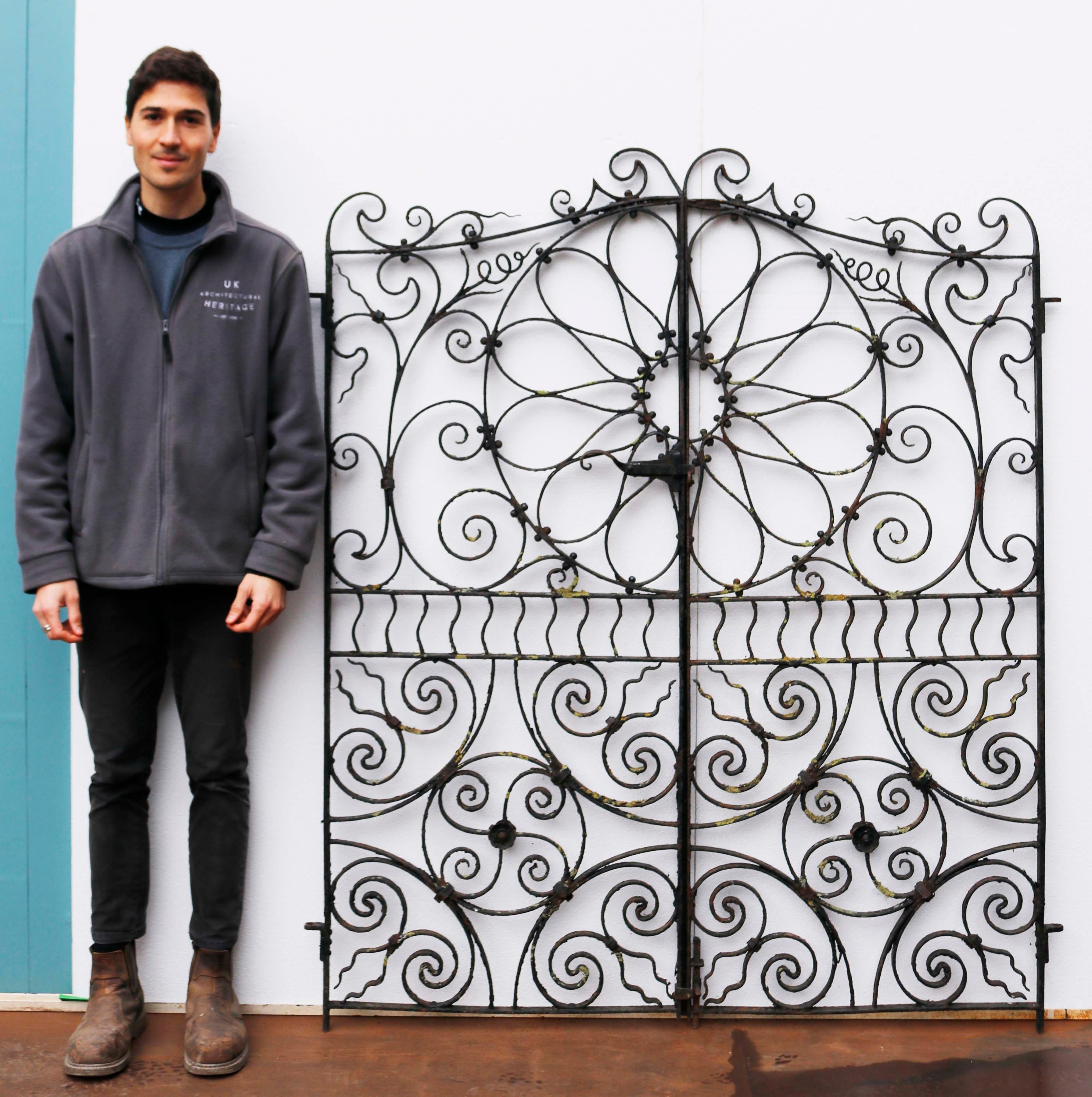Set of mid-Victorian Pedestrian gates. These Blacksmith made gates have an unusual repeated scrolling pattern featuring a centre roundel.

Additional dimensions
For an opening of approximately 149 cm.