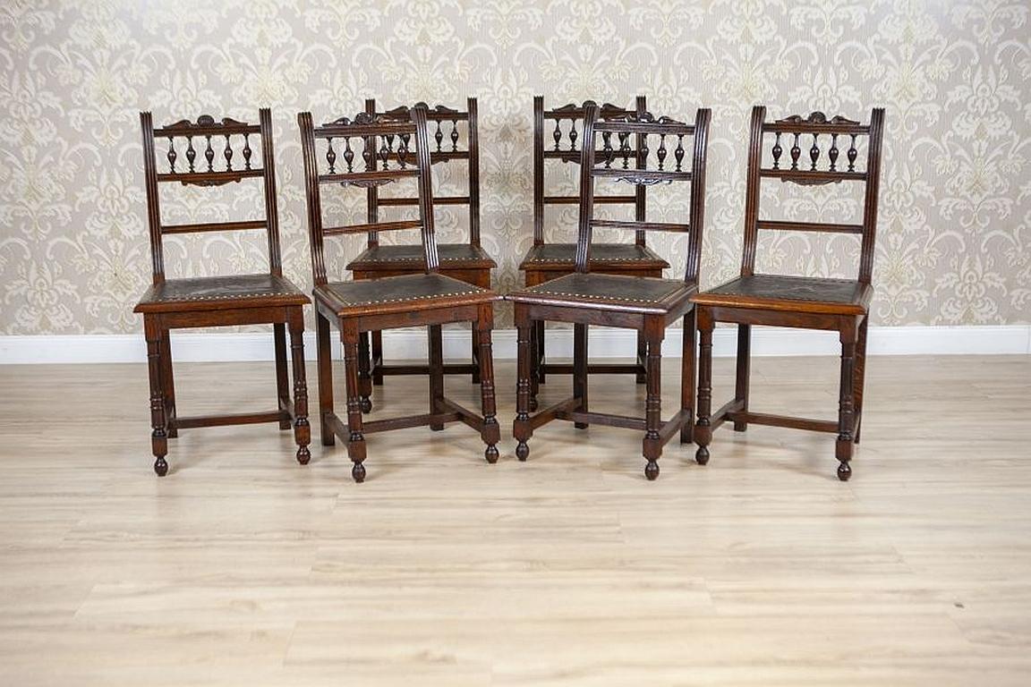 Set of Decorative Oak Chairs From the Early 20th century.

We present you these oak chairs with high backrest. Front legs of the chairs are rounded and seats upholstered with embossed leather. Leather is fixed to the whole with brass tacks.
